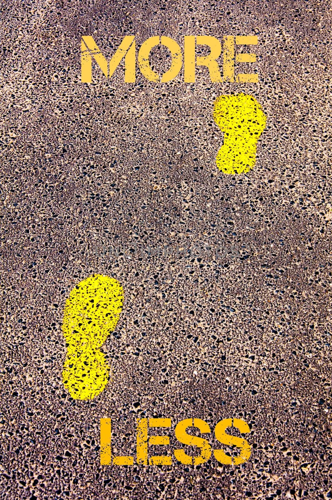 Yellow footsteps on sidewalk from Less to More message. Conceptual image