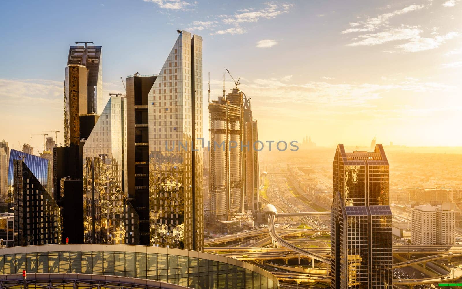 Bird's eye view of Dubai skyline and rush hour traffic in downtown