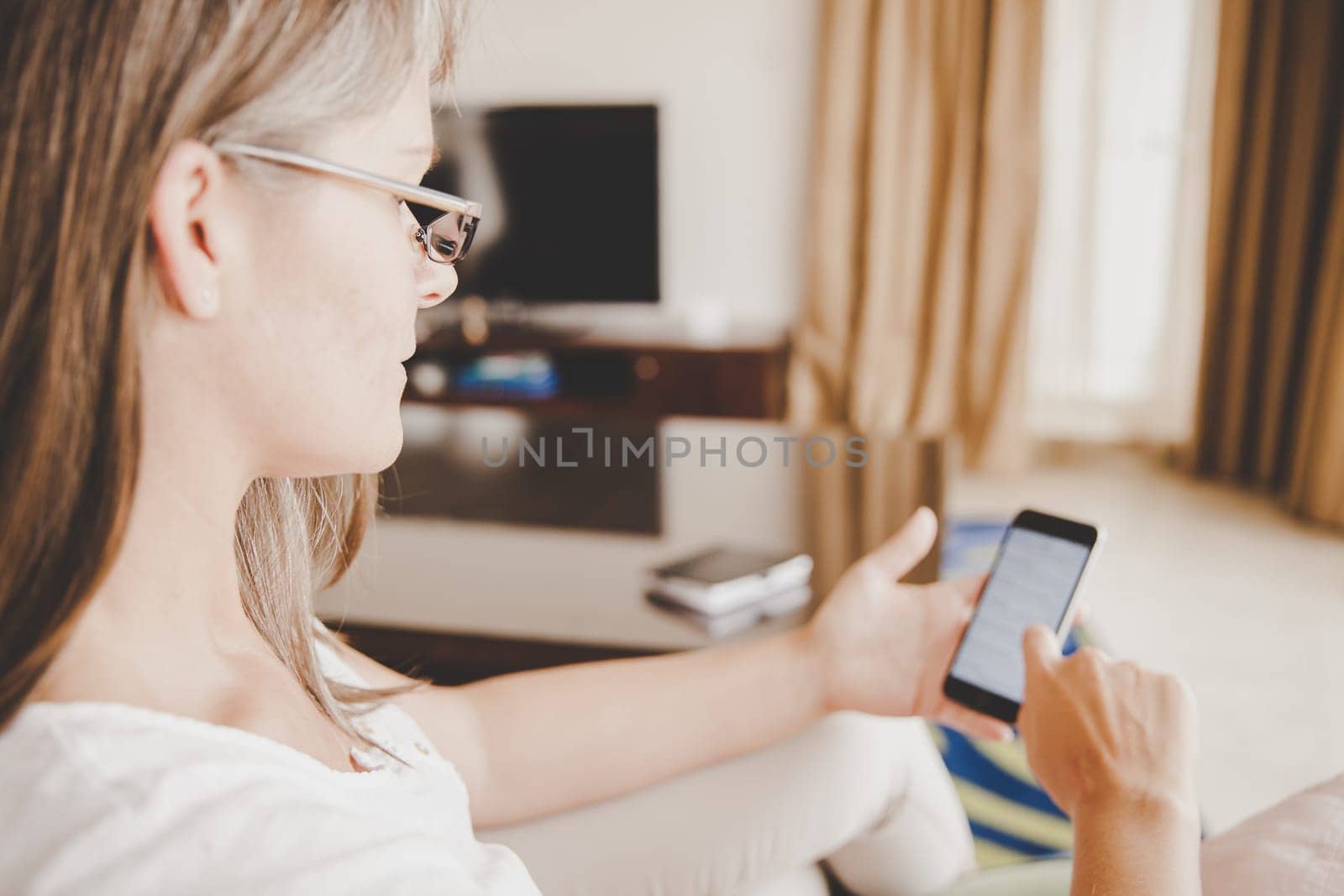 mature woman is waiting for her phone to ring