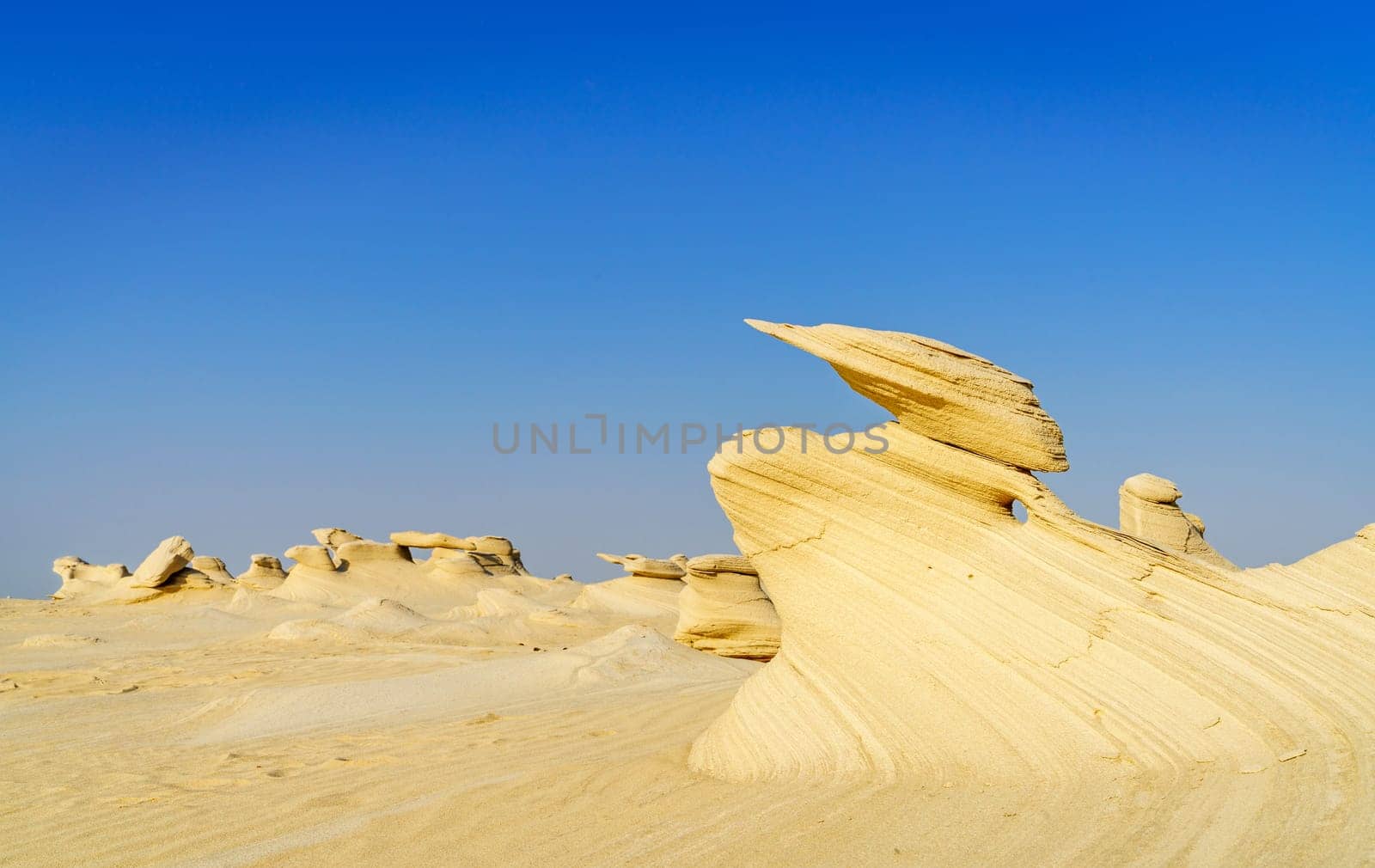 Sandstone formations in Abu Dhabi desert in United Arab Emirates