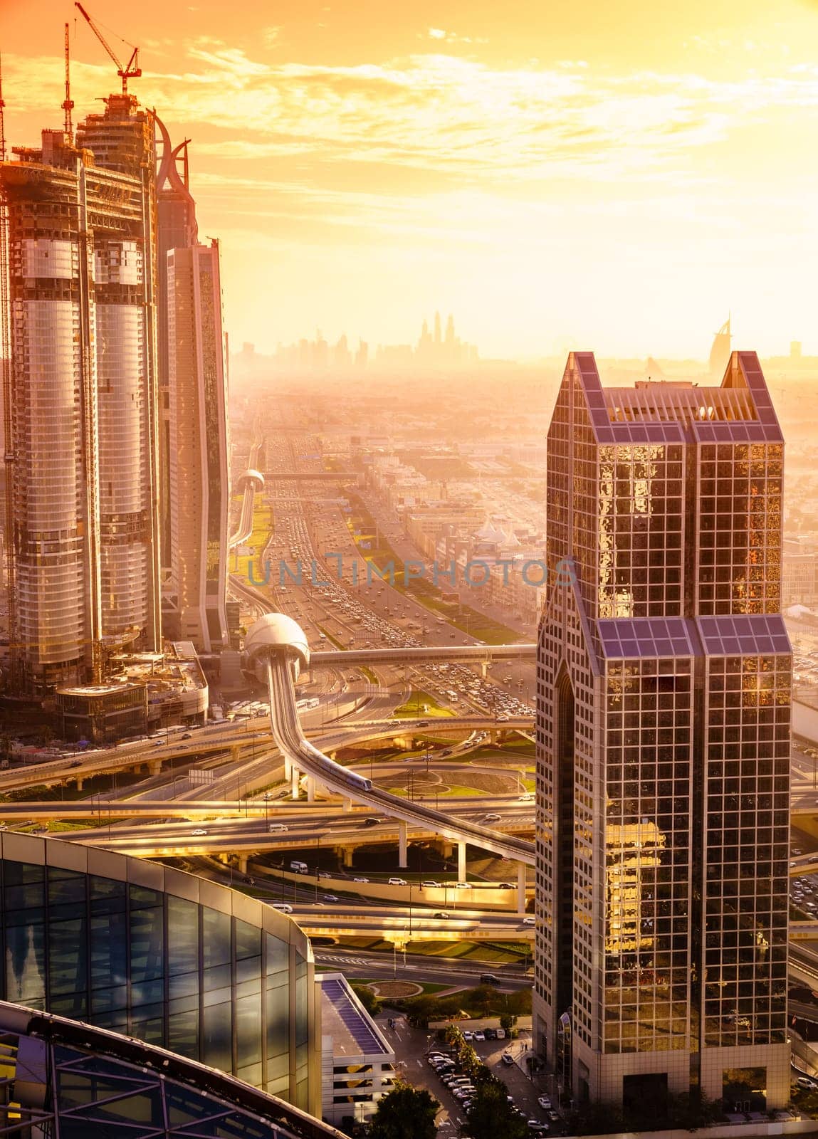 Bird's eye view of Dubai skyline and rush hour traffic in downtown