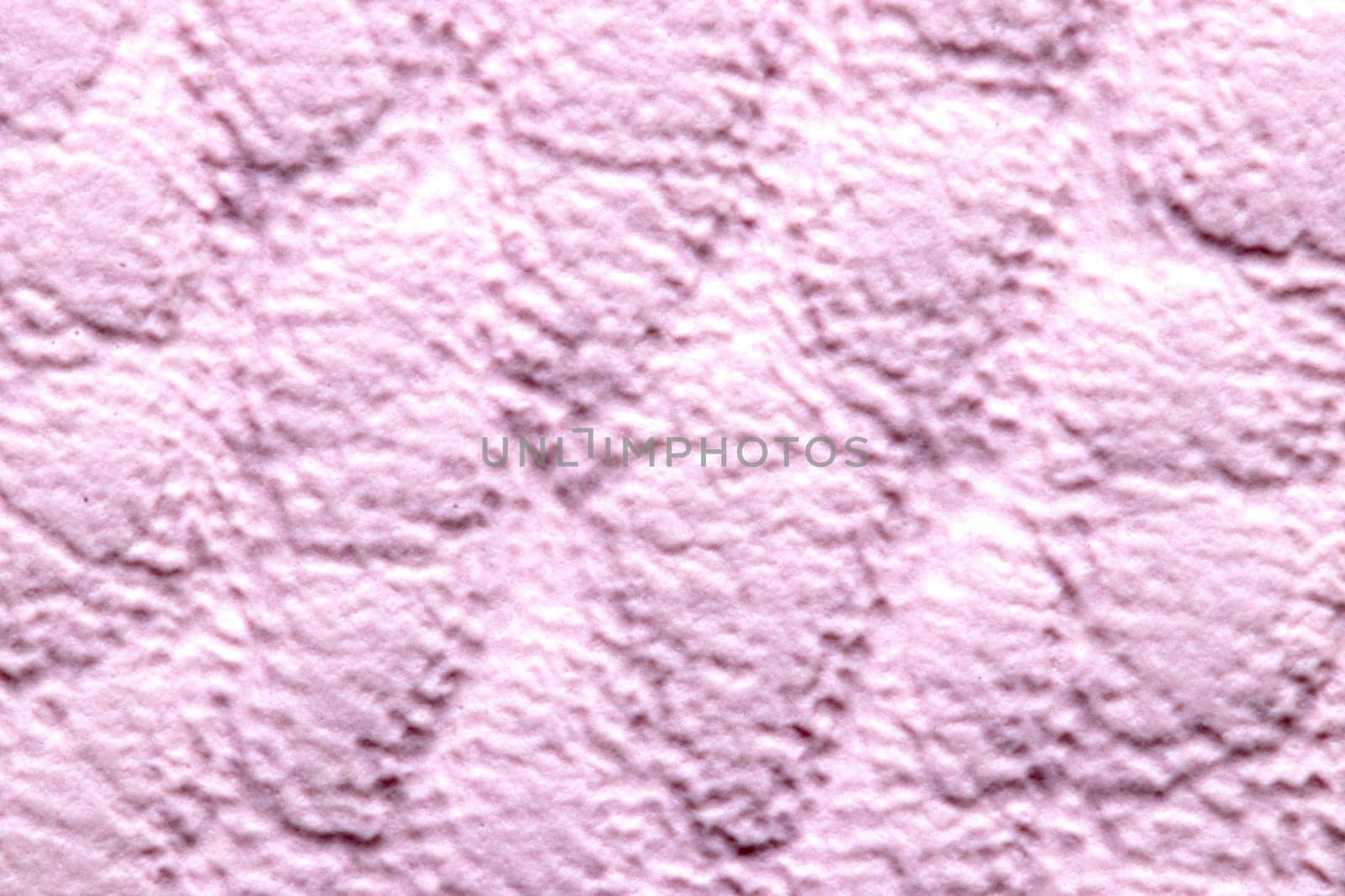 Leather background texture. A high-resolution closeup of a detail from a light pink imitation leather hand bag. Decoration background and design element. Macro.