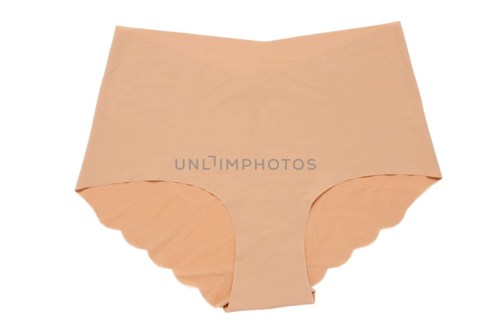 Underwear woman isolated. Close-up of beige or flesh-colored seamless panties isolated on a white background. Useful for wearing under bright or transparent dresses. Underwear fashion.