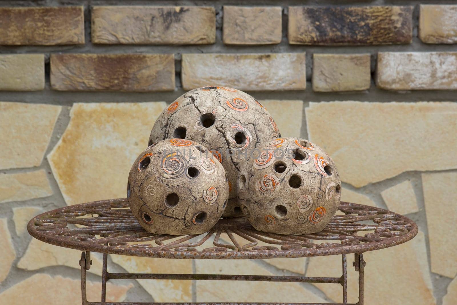 handmade balls of light on old metal table