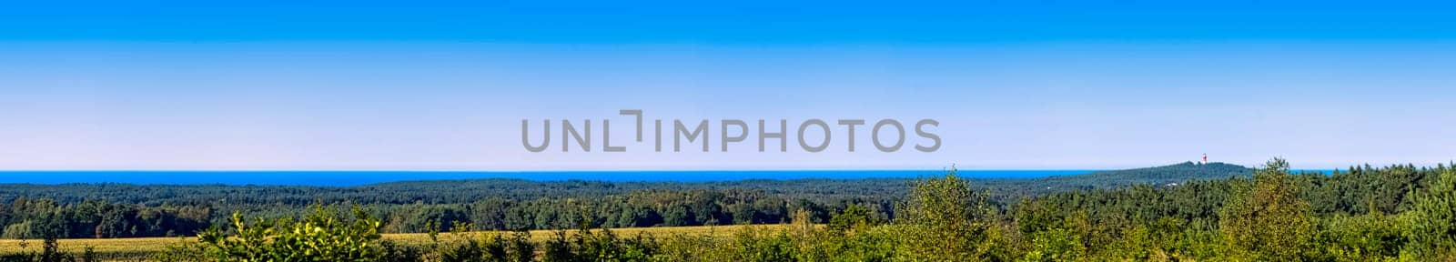 Panoramic view of Polish seacoast with lighthouse in background - Stilo, Pomerania, Poland
