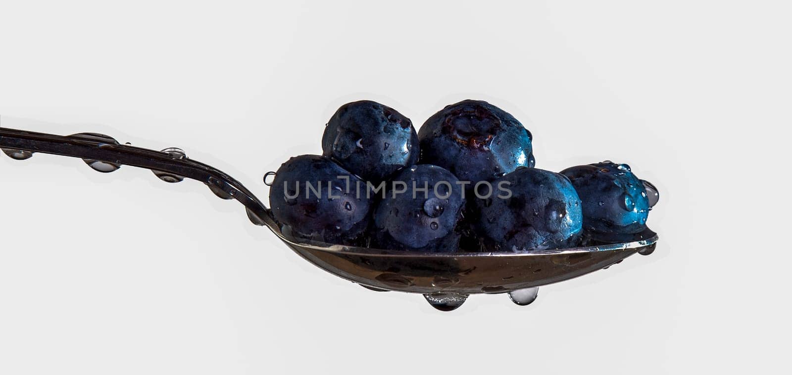 Blueberries ready to eat, on a spoon