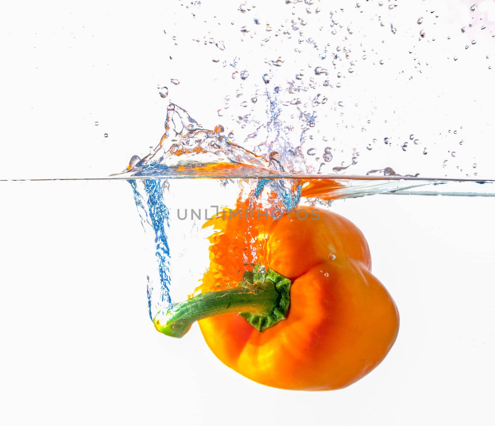 Orange Bell Pepper Dropping Into Water