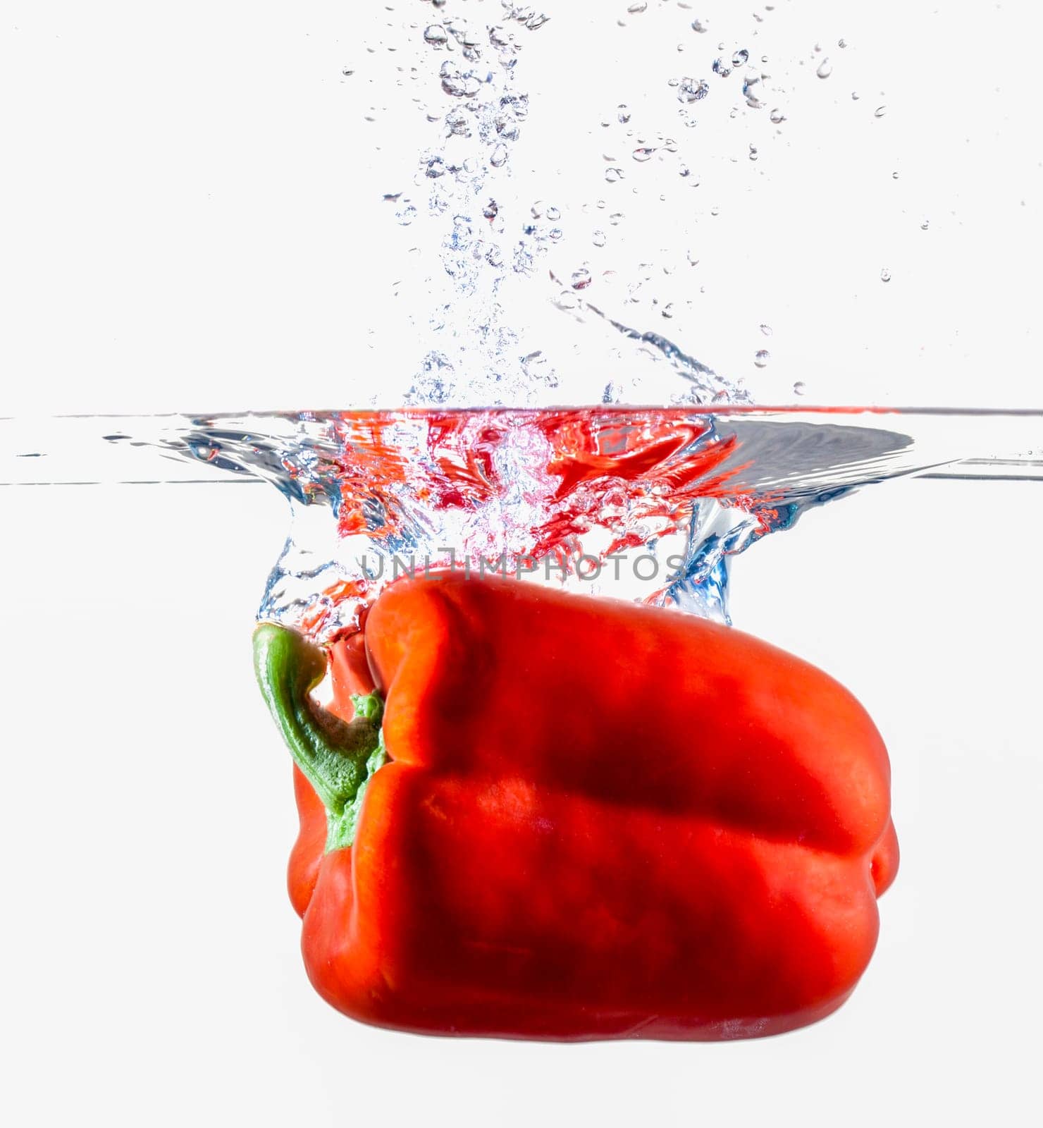 Red Bell Pepper Dropping Into Water