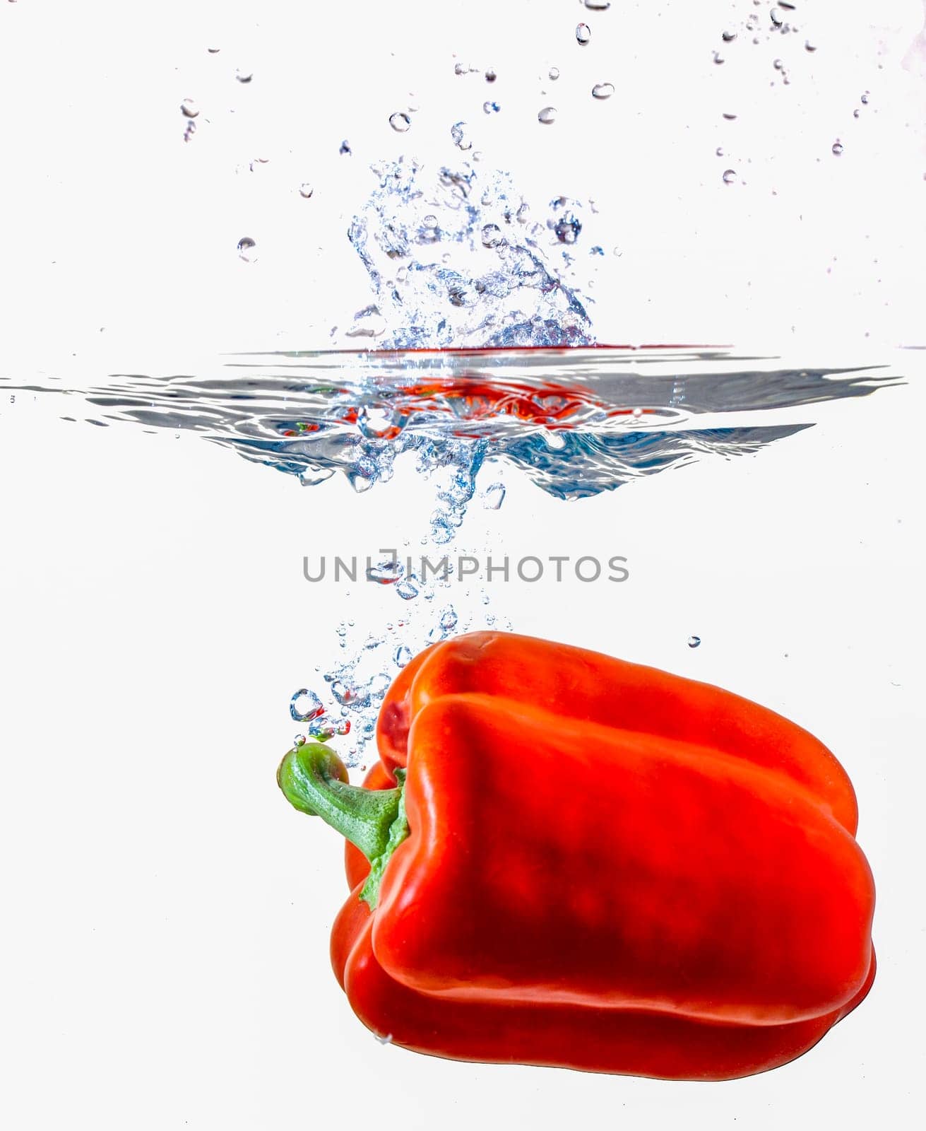 Red Bell Pepper Dropping Into Water