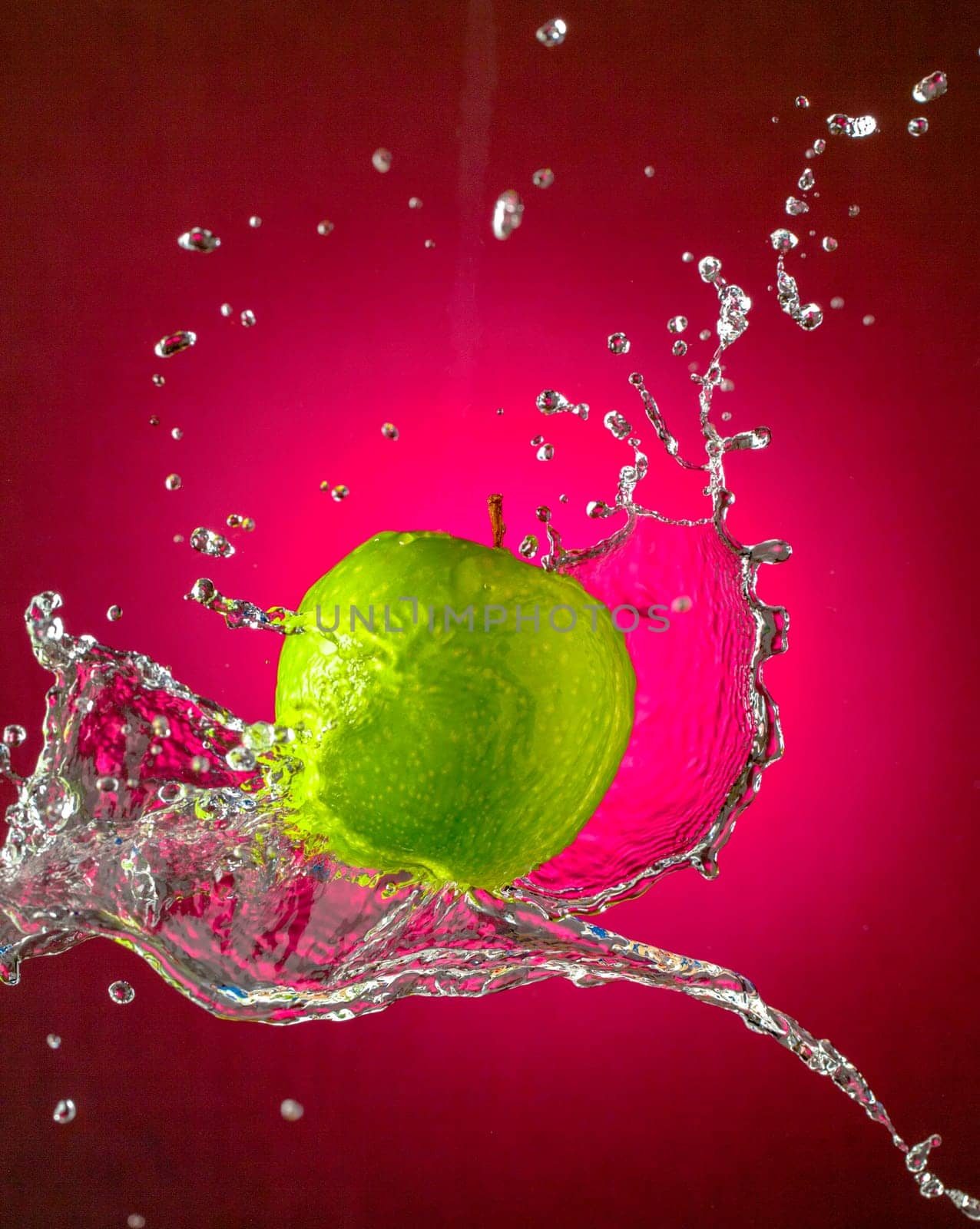 Water Splashes on Green Apple