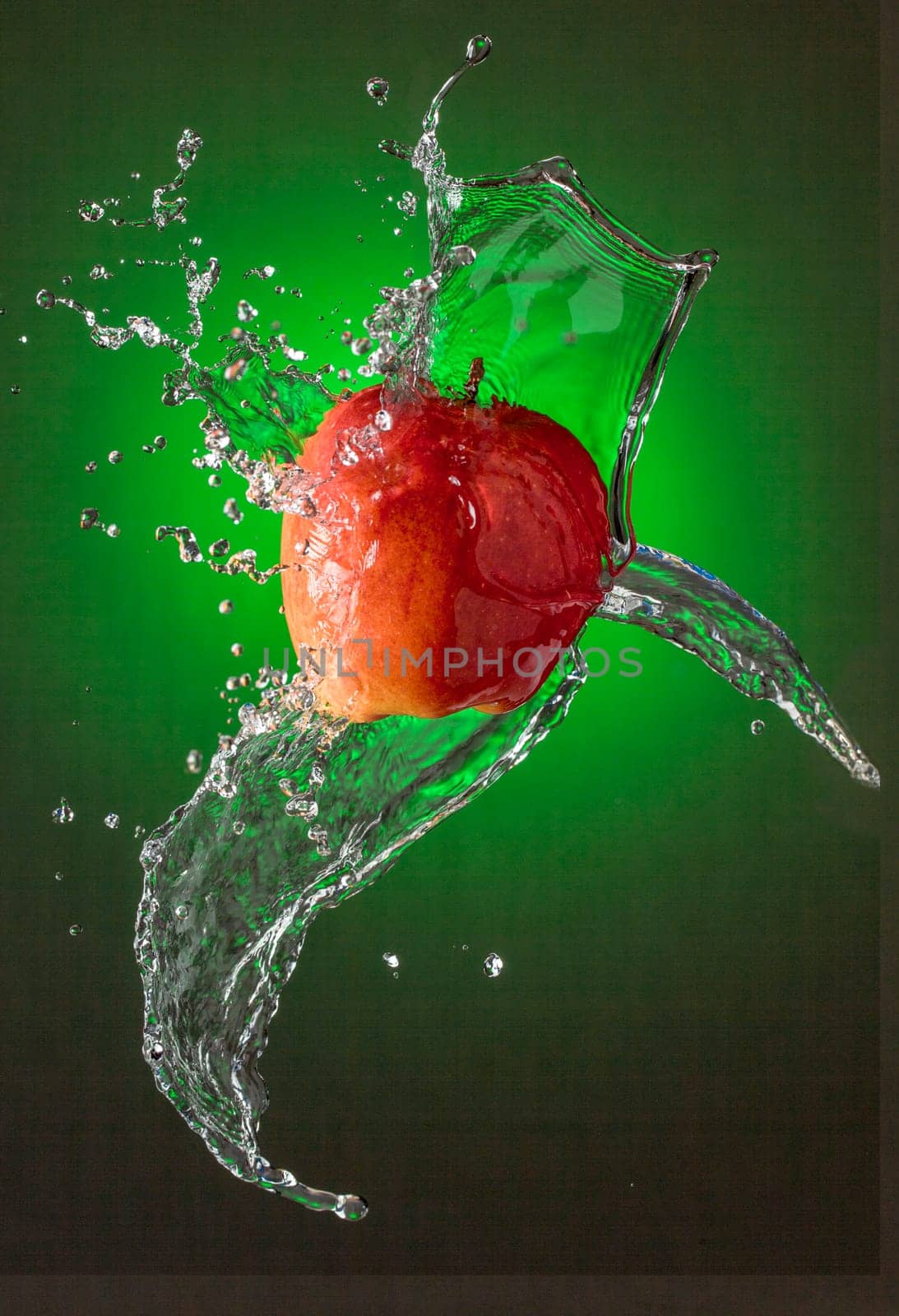 Water Splashes on Red Apple