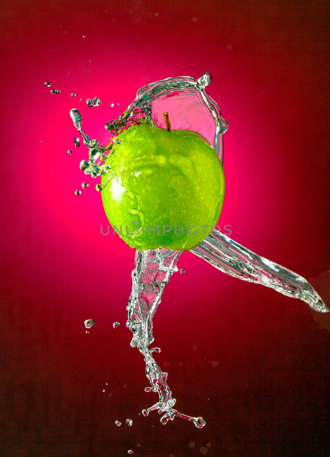 Water Splashes on Green Apple