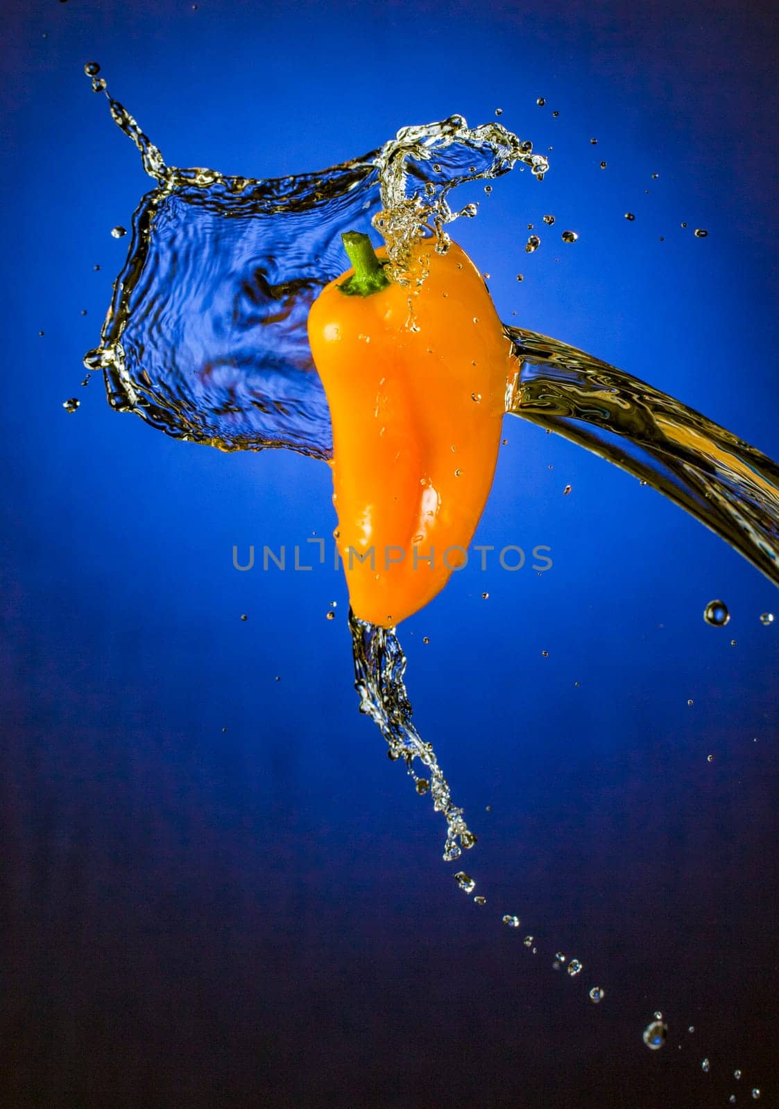 Water Splashing on Orange Mini Pepper