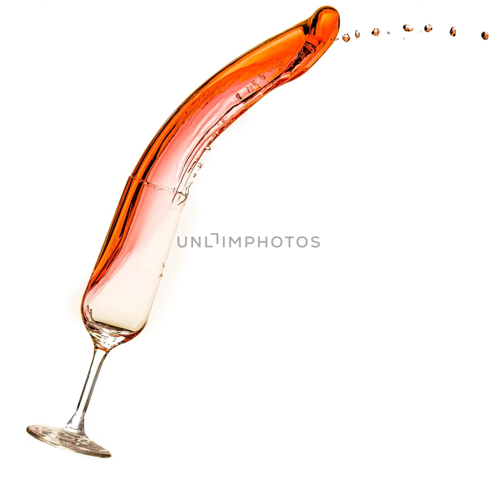 Wine being poured into glass, with slop spilling over.