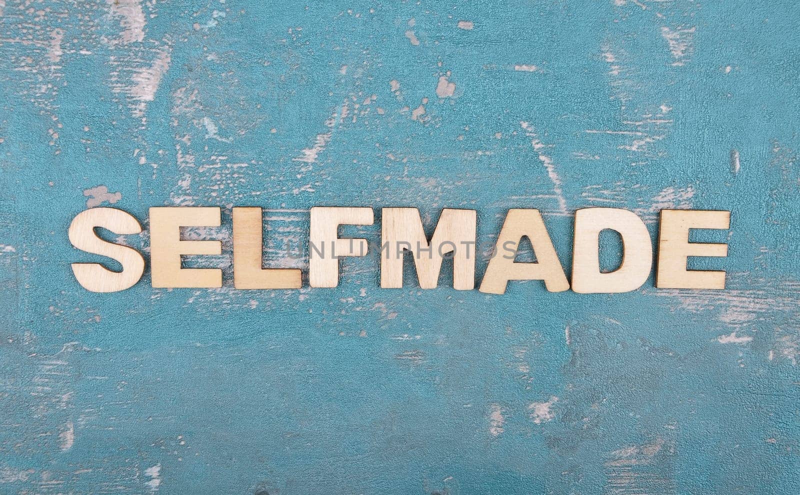 Term from wooden letters on weathered concrete