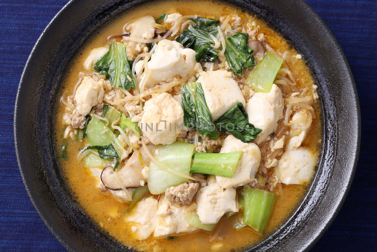 Chinese cuisine mapo tofu in a dish on wooden tray, Japanese style,