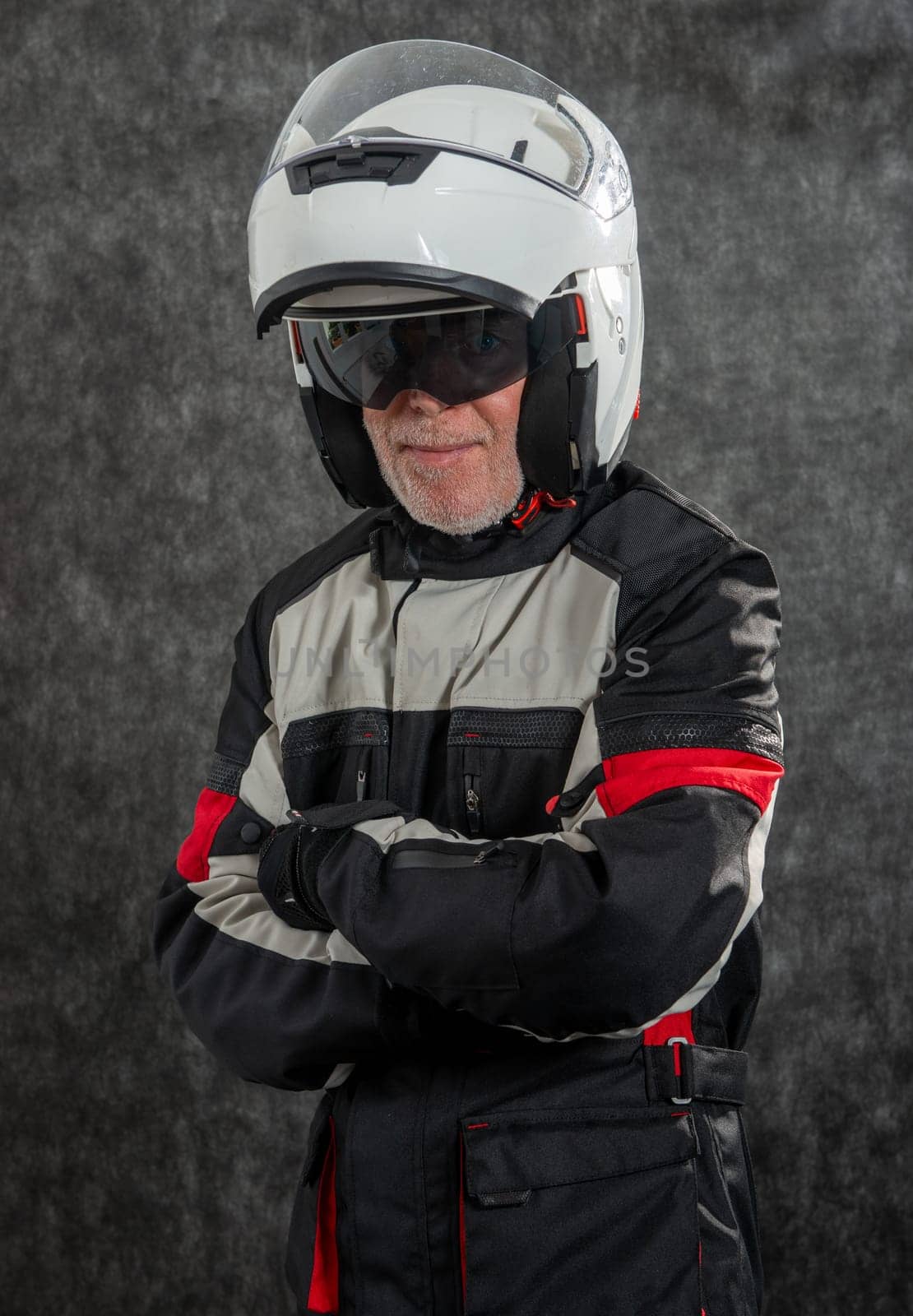 portrait of senior biker with a white helmet