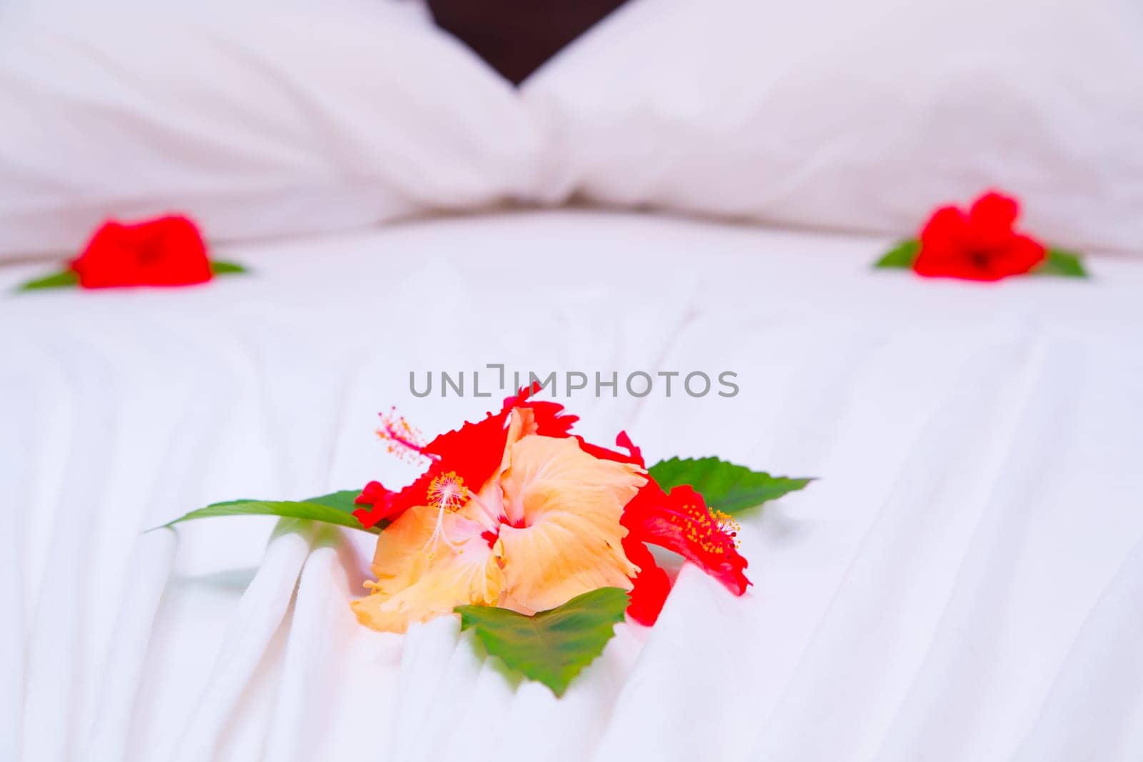 Flower decoration on the bed in a hotel