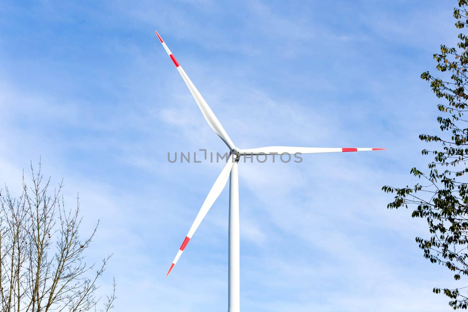 A Wind turbine with a blue sky in the background