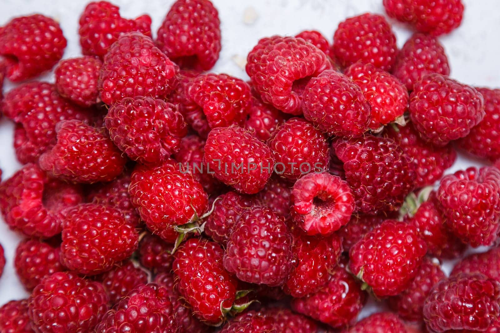 Fresh and sweet raspberries background