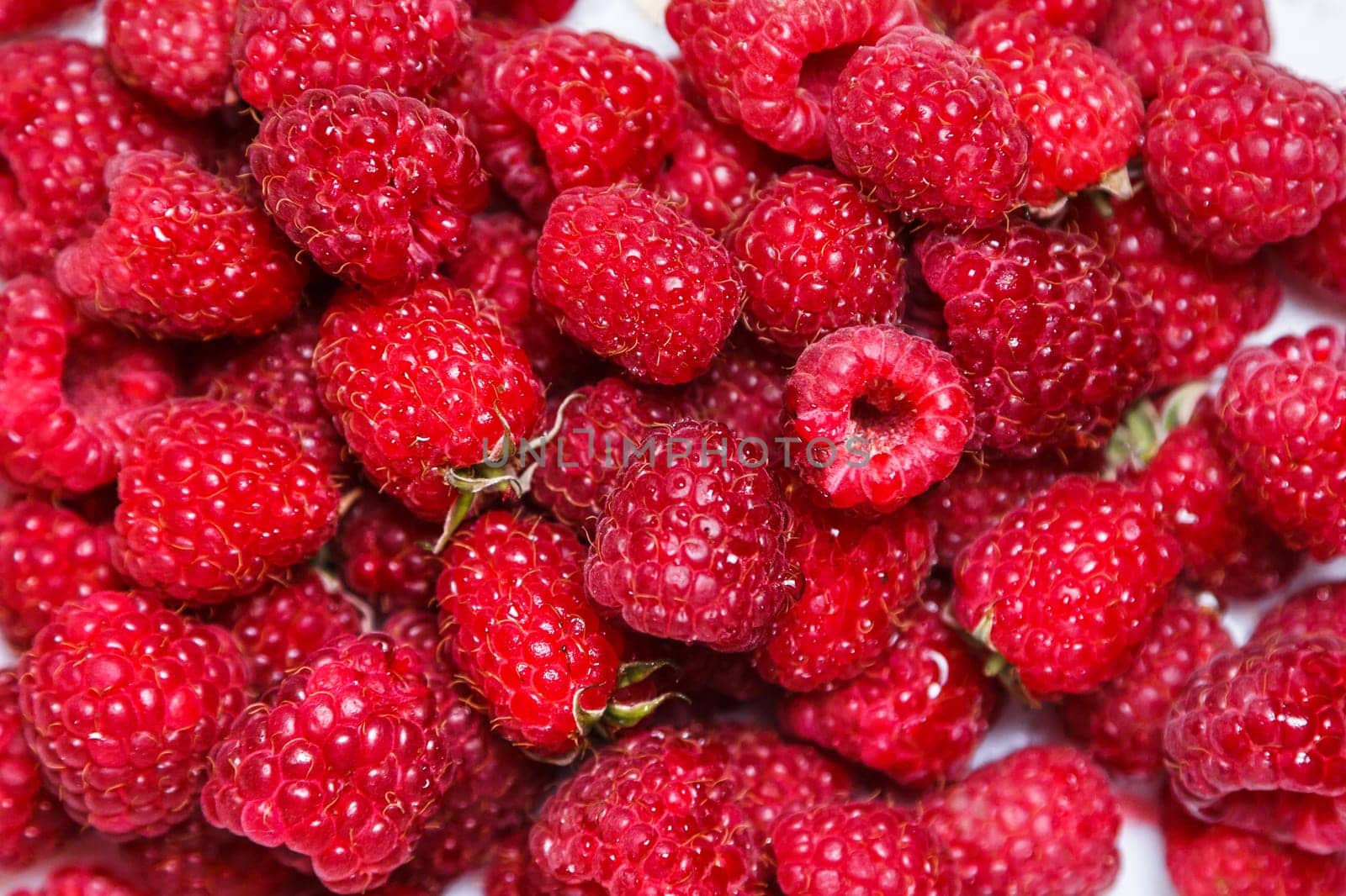 Fresh and sweet raspberries background