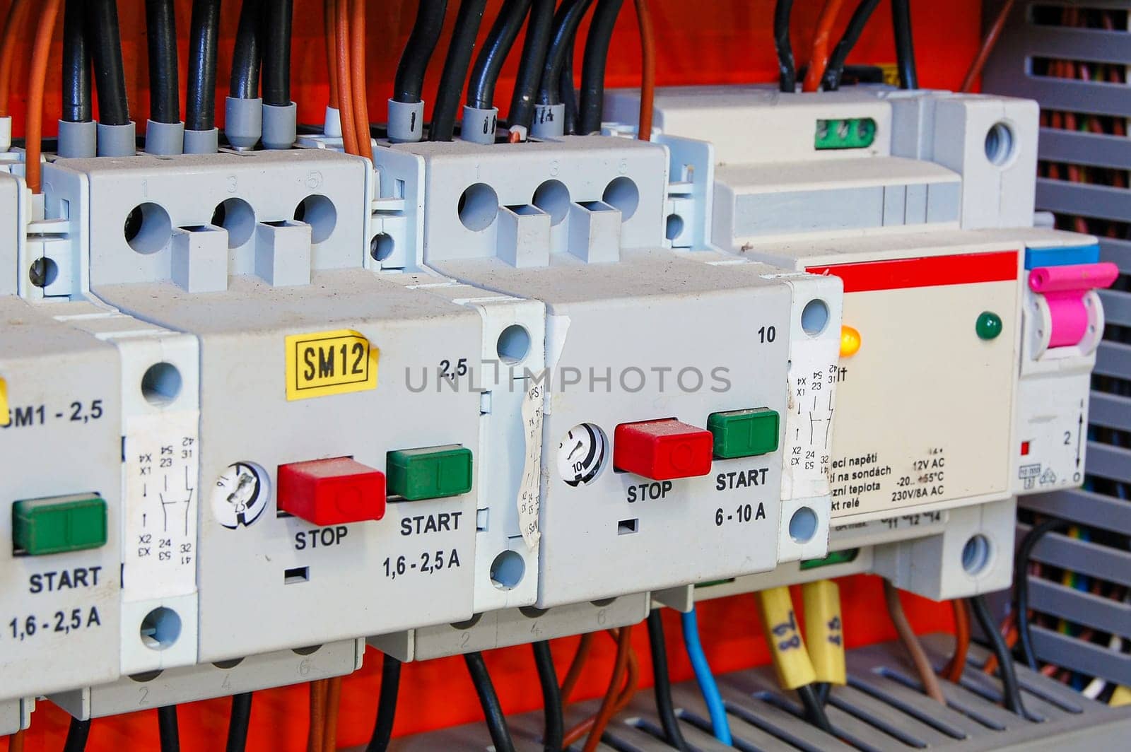Electrical equipment. Automatic circuit breakers in a row. Electric switches in fusebox.