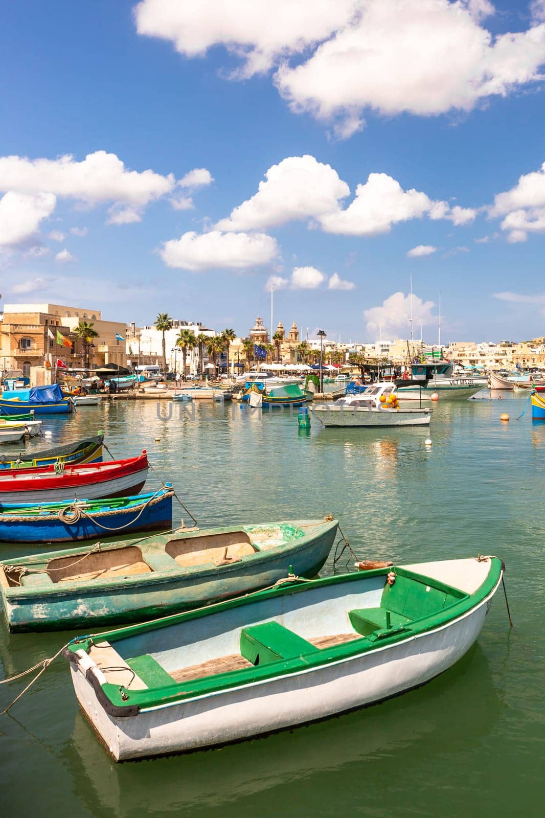 Marsaxlokk village harbor of Malta, Mediterranean traditional colorful boats luzzu. Island of Malta.
