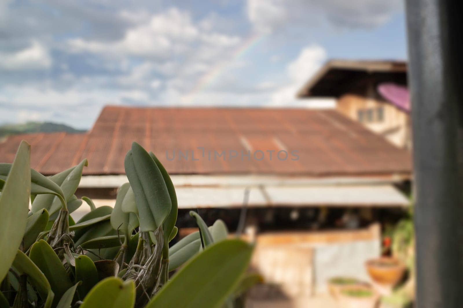 Vintage house roof with cloudy sky, stock photo