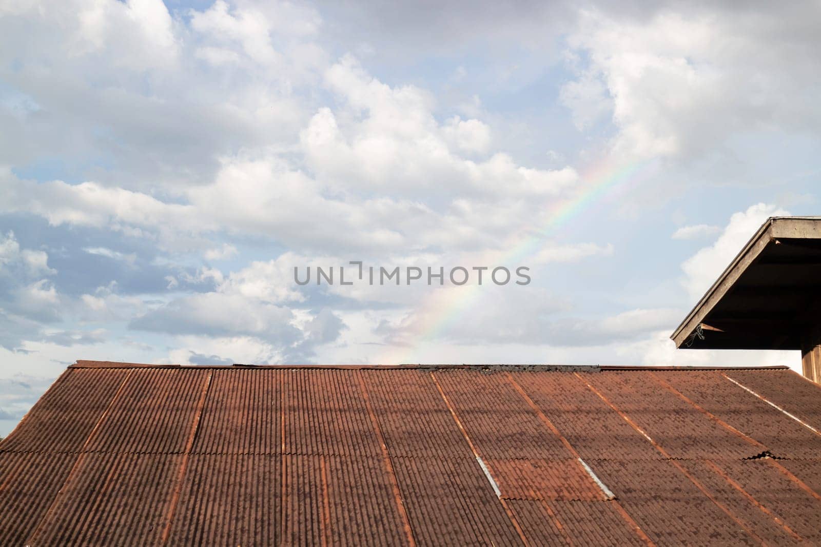 Vintage house roof with cloudy sky, stock photo