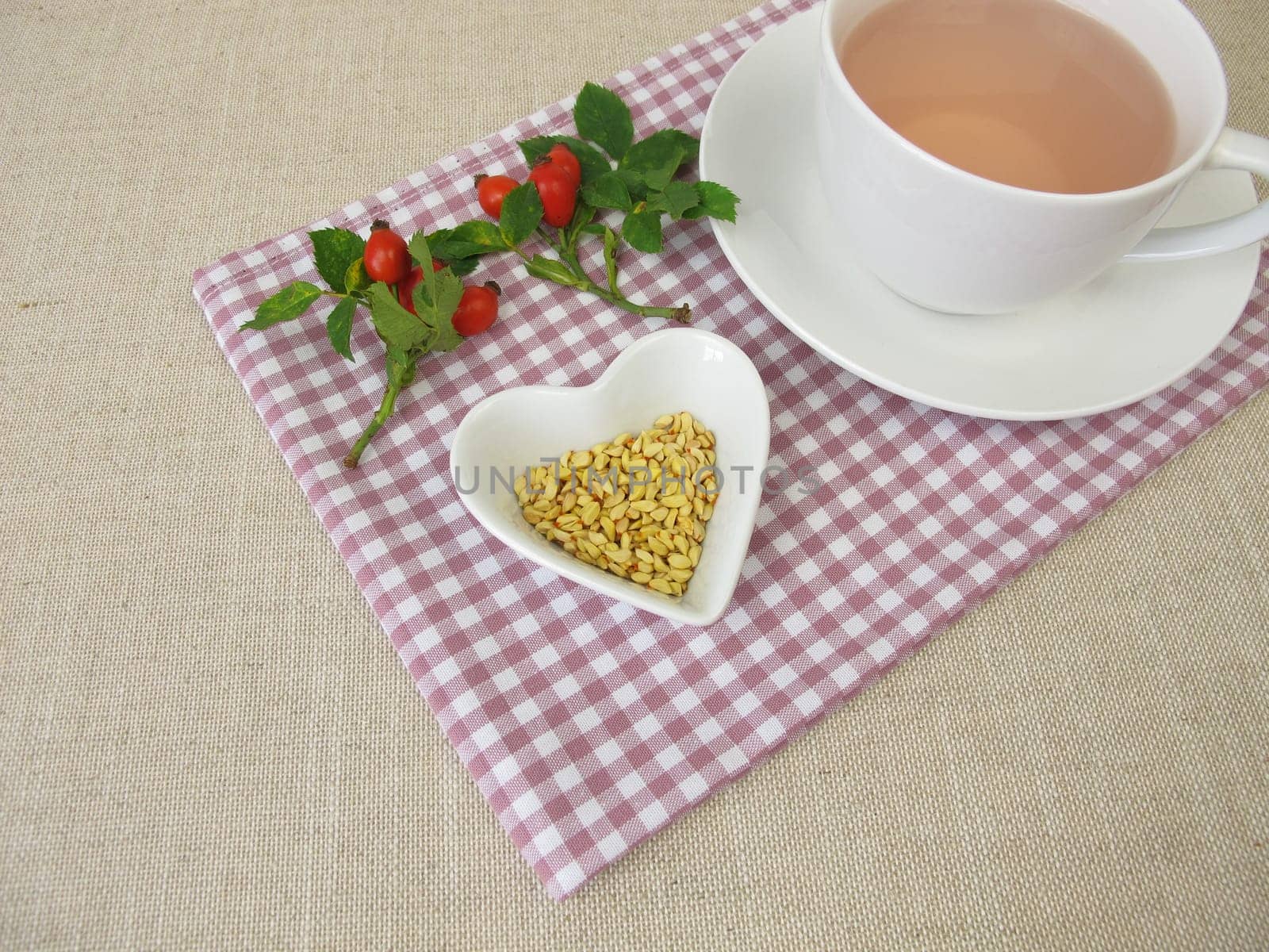 A cup of kernels tea from rose hip seeds