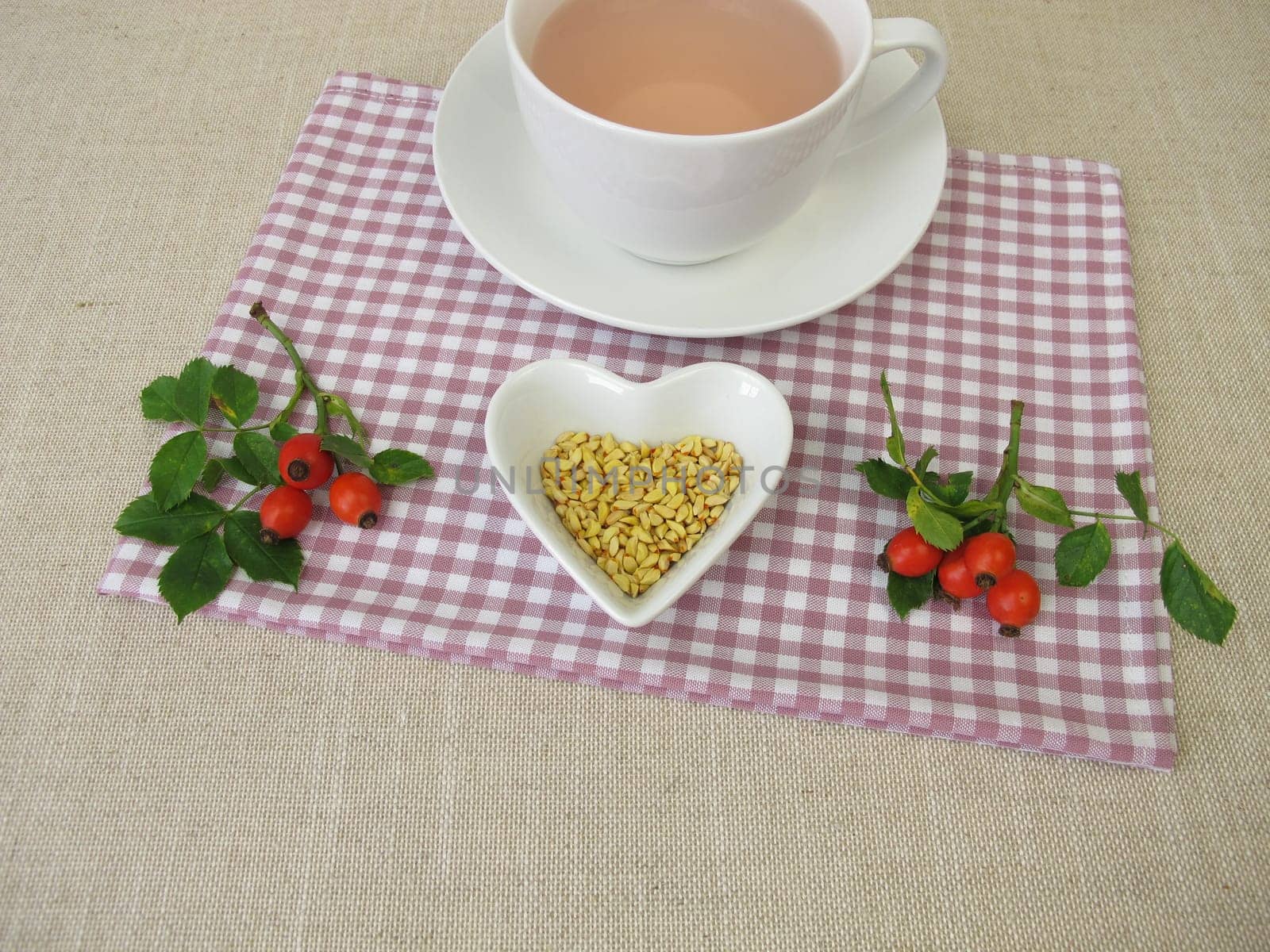A cup of kernels tea from rose hip seeds