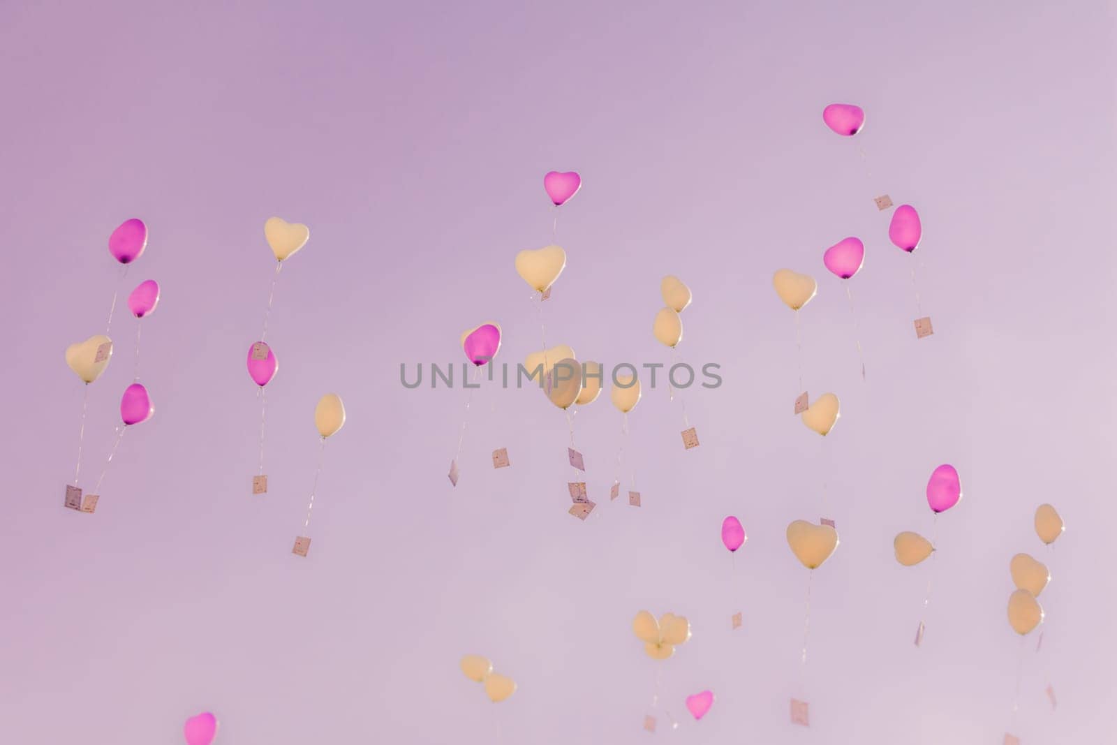 Romantic symbol of future partnership. Group of beautiful heart ballons with congratulations cards at wedding party or valentines day.