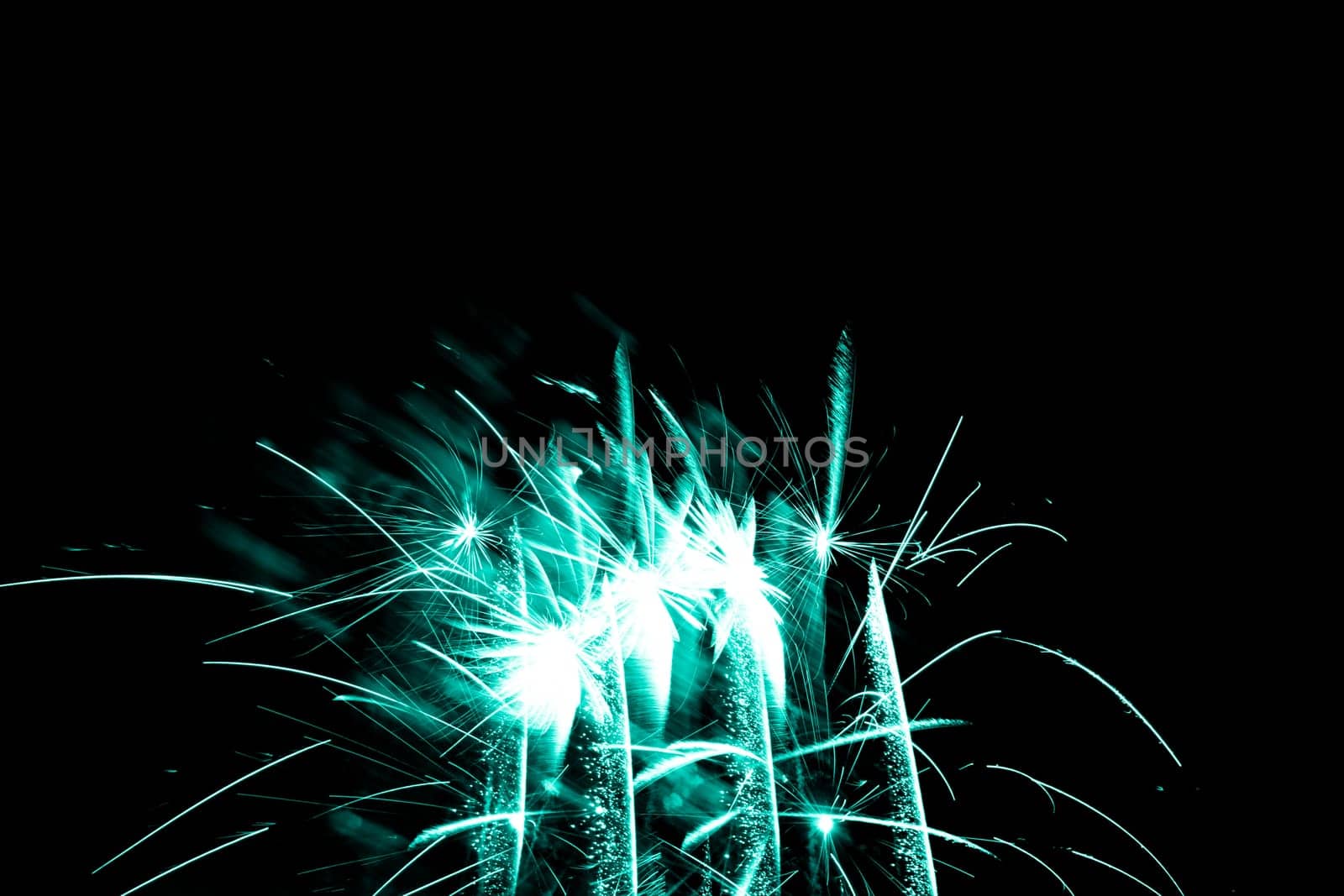 Premium entertainment magic star firework at e.g. New Years Eve or Independence Day party celebration. Black dark night background.