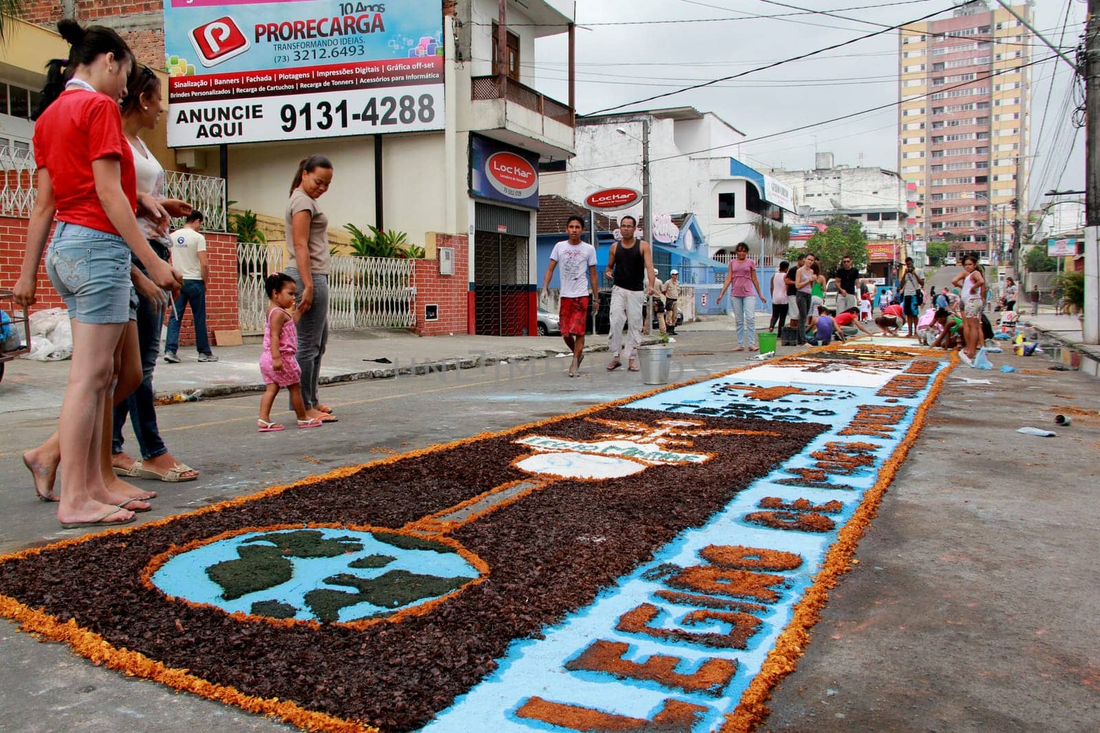 Itabuna, Bahia / Brazil - June 7, 2012: People are seen making traditional tapes during the Corpus Crist holiday festivities in Itabuna.