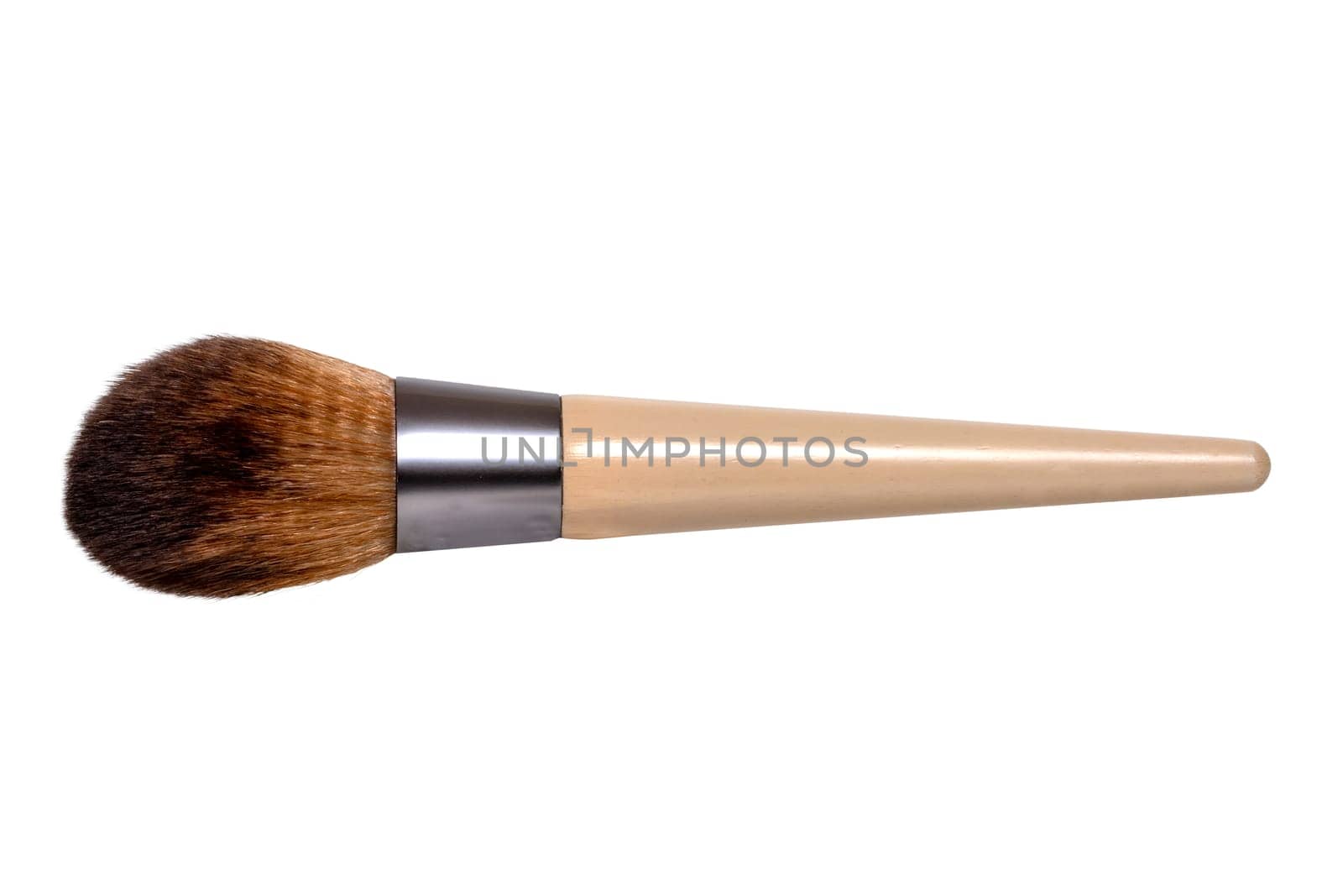 Closeup of a wooden new professional makeup brush isolated on a white background. Concept beauty. Macro photograph.