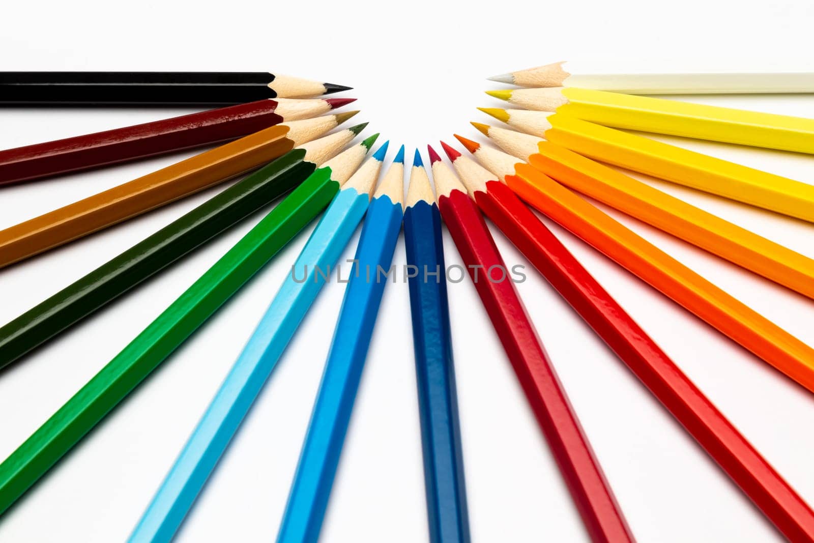 Some colorful wooden pencils on a white background