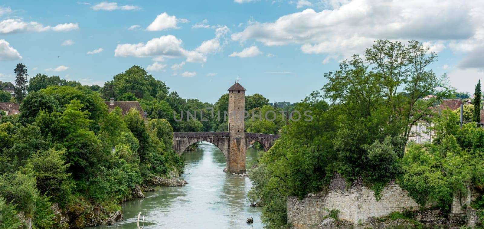a medieval bridge over river Gave de Pau in Orthez - France