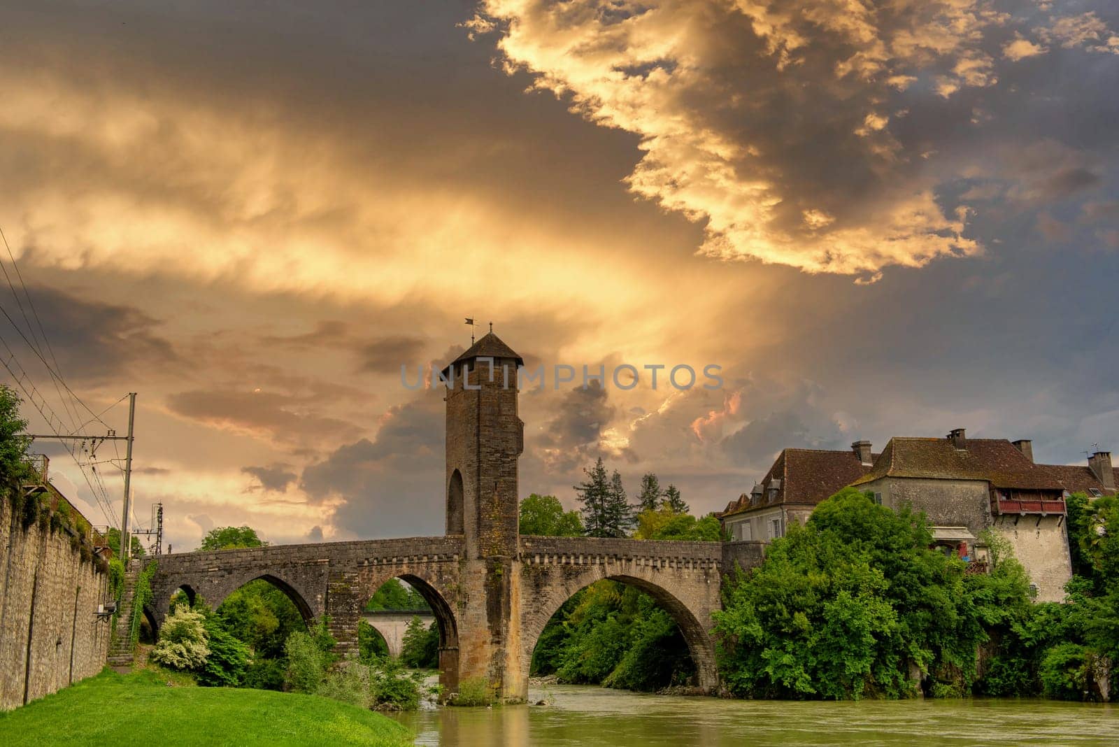 a medieval bridge over river Gave de Pau in Orthez - France