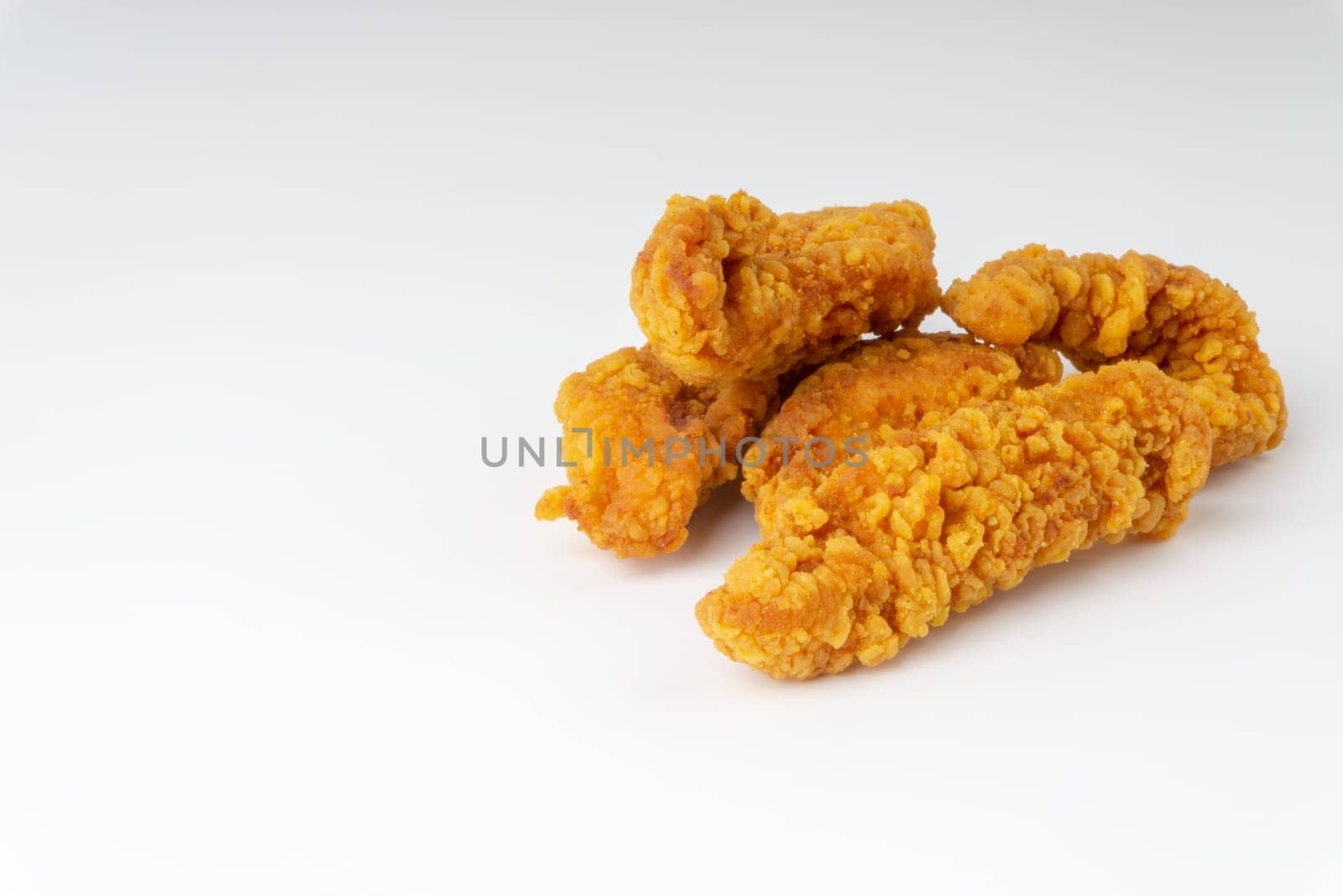 Fried breaded chicken fillet isolated on white background