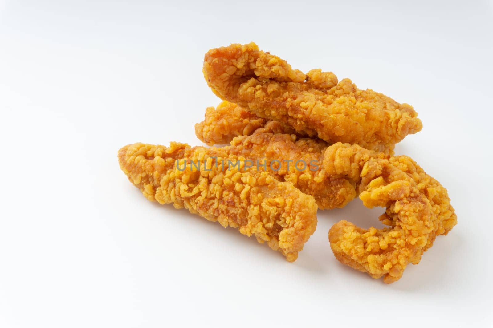 Fried breaded chicken fillet isolated on white background