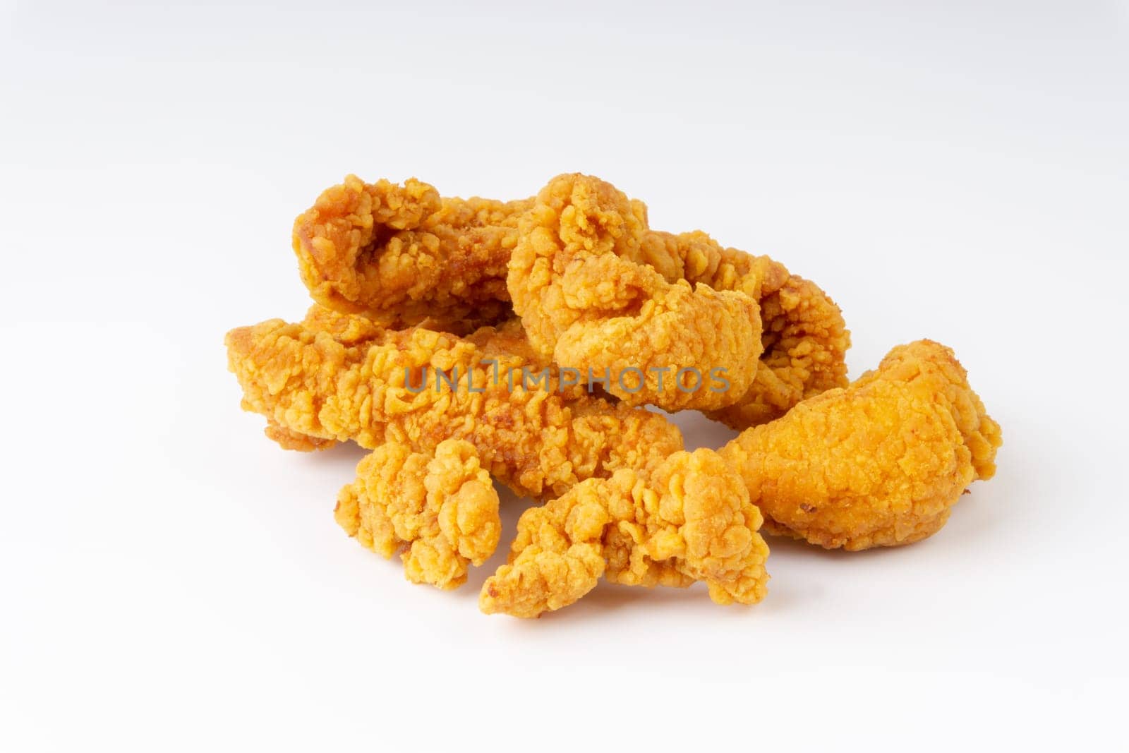 Fried breaded chicken fillet isolated on white background