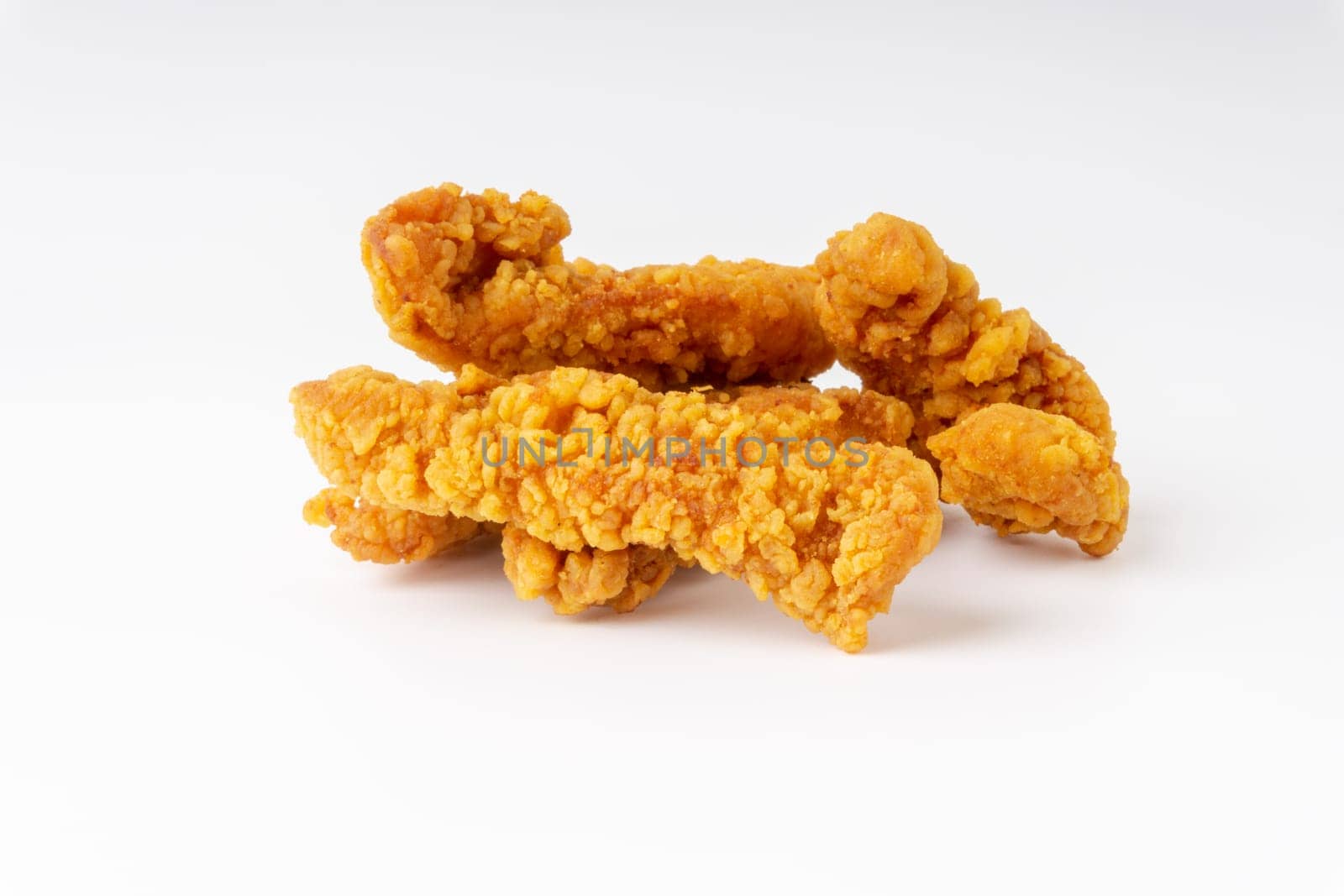Fried breaded chicken fillet isolated on white background