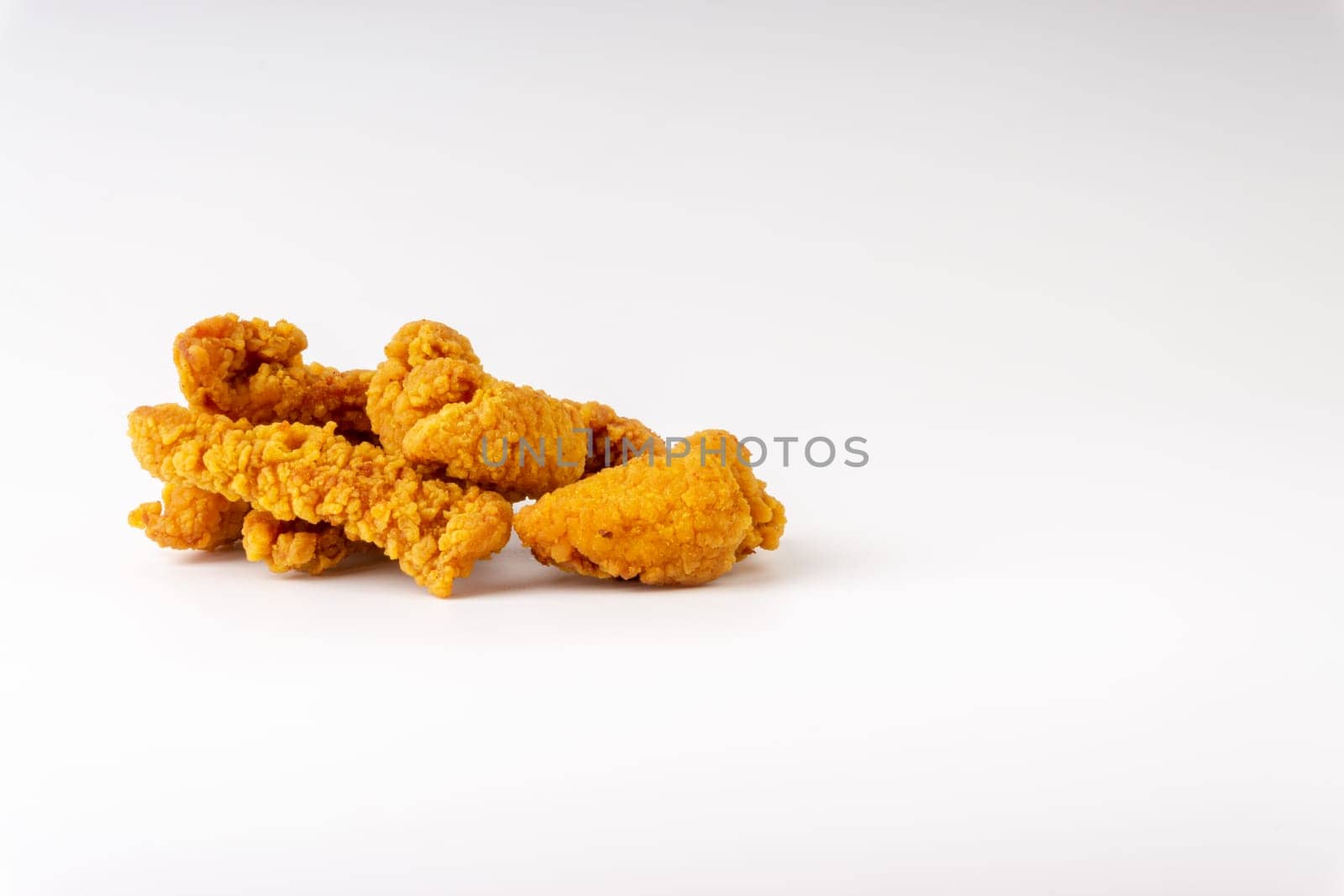 Fried breaded chicken fillet isolated on white background