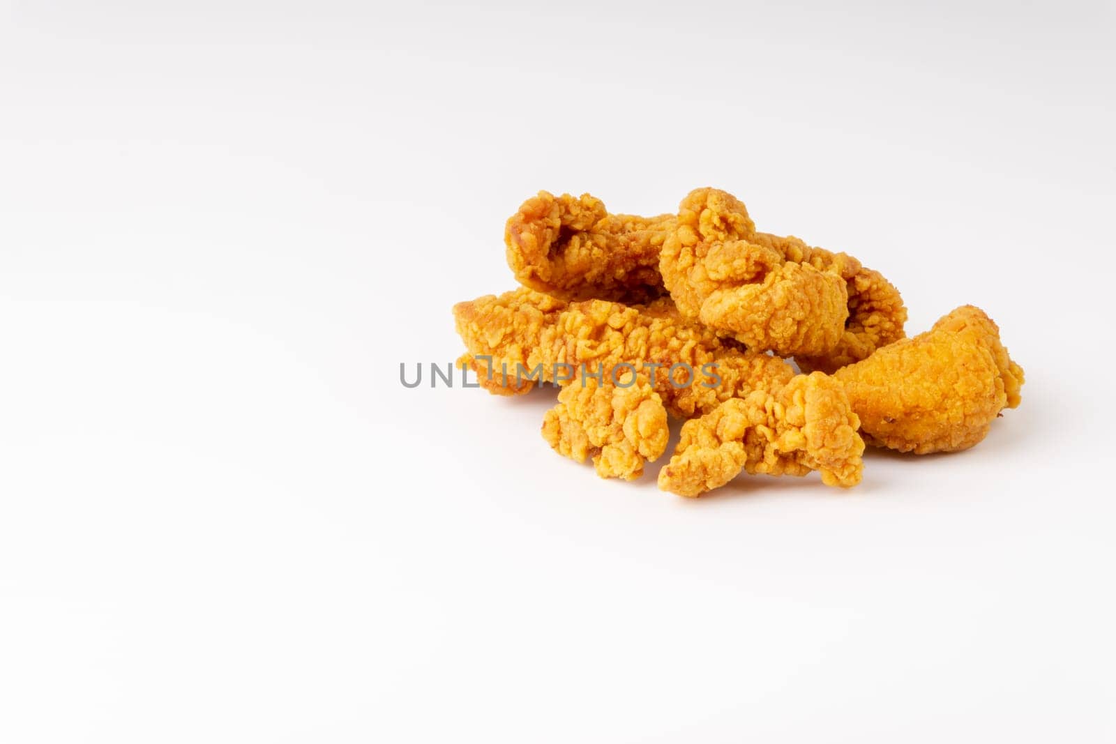 Fried breaded chicken fillet isolated on white background