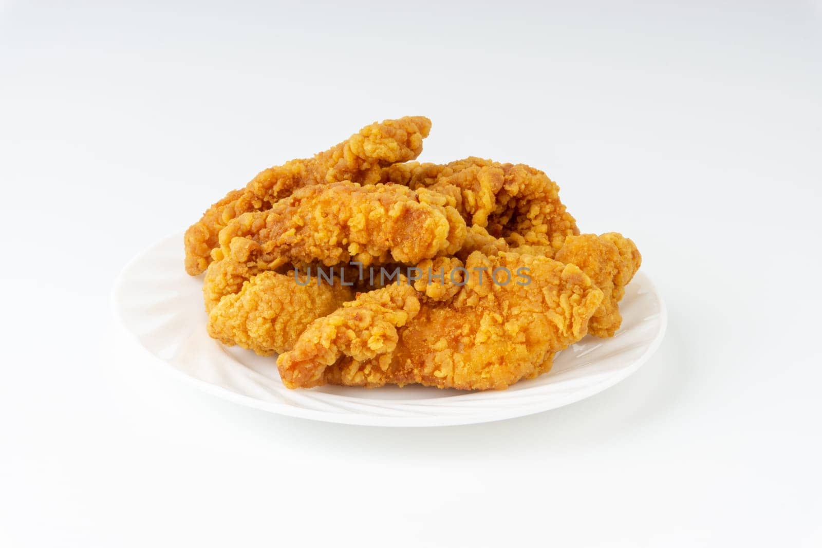 Fried breaded chicken fillet isolated on white background
