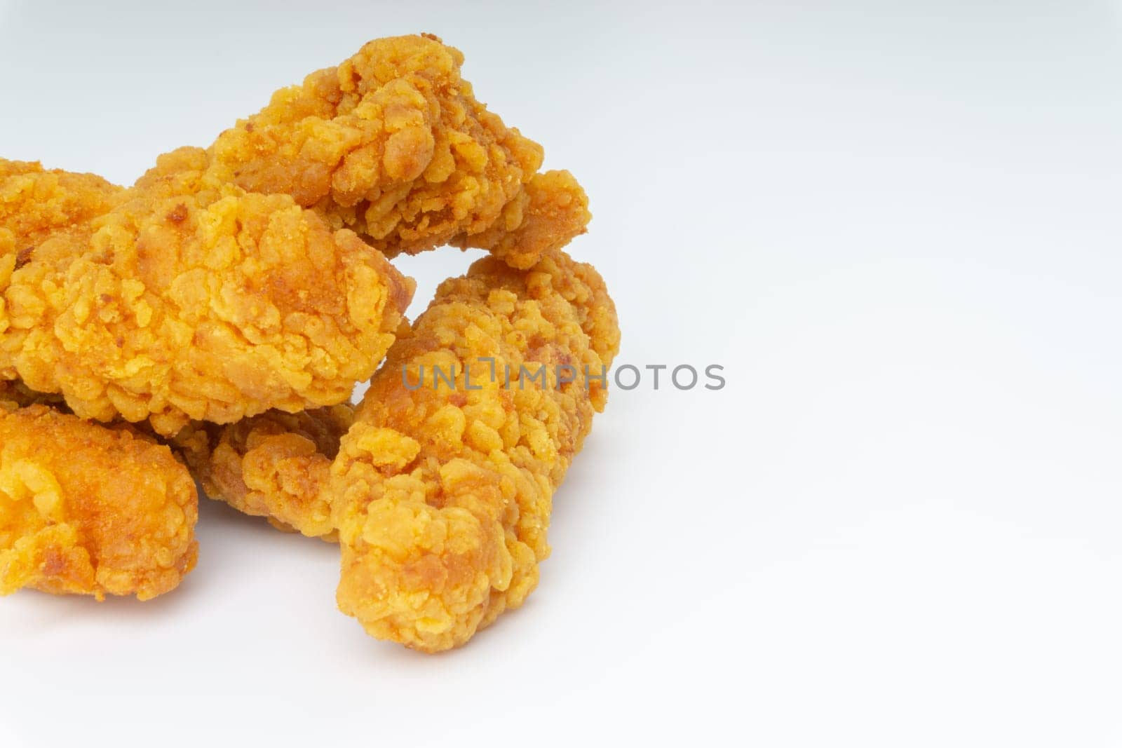Fried breaded chicken fillet isolated on white background