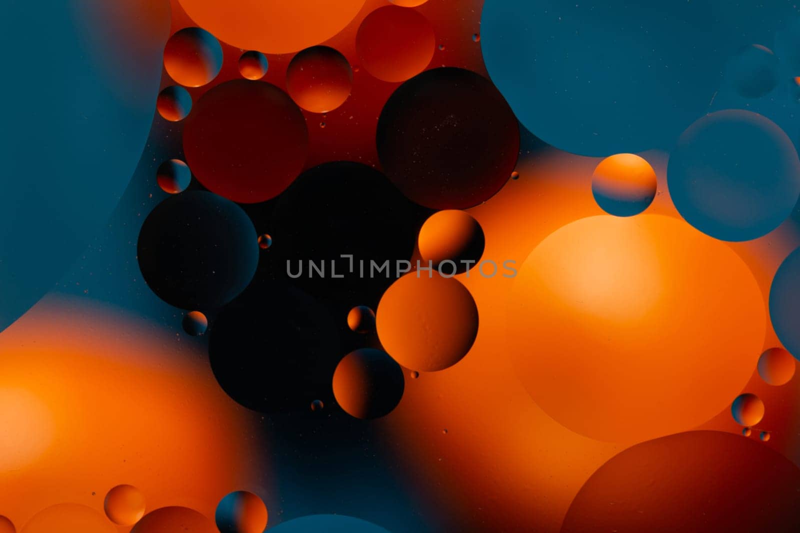 a Close-up water and oil abstract in a rainbow lighting effect