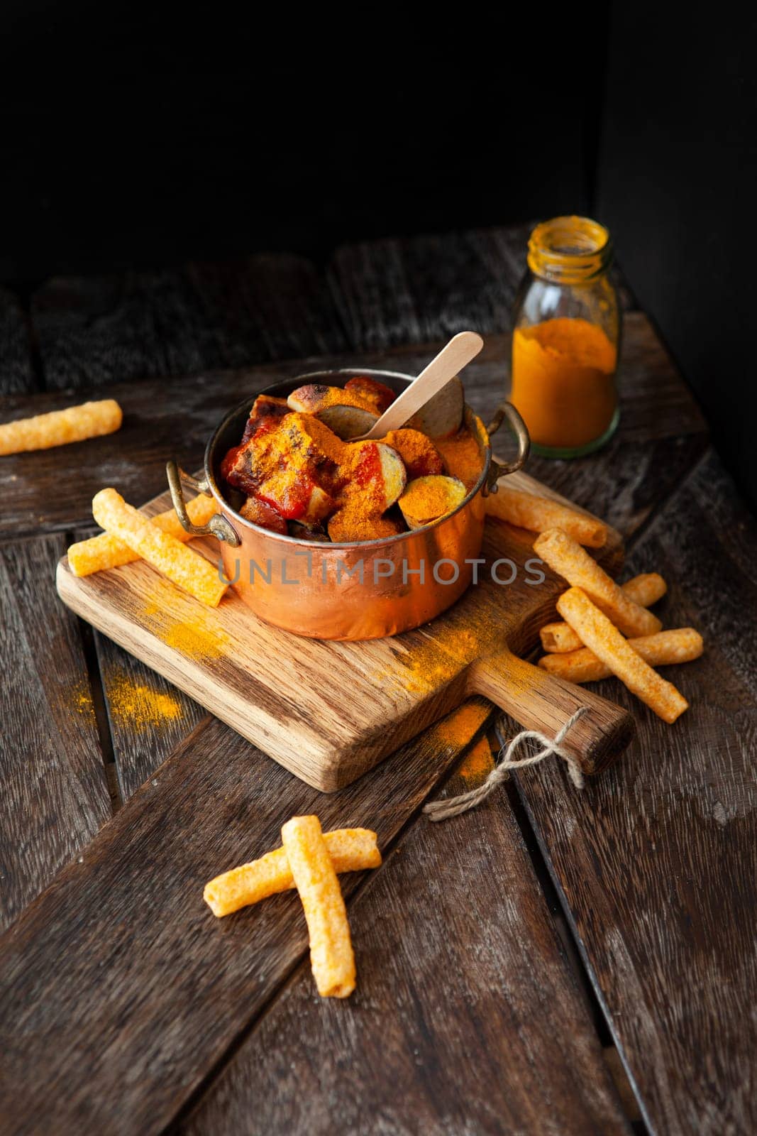Delicious bratwurst with a spicy tomato curry sauce