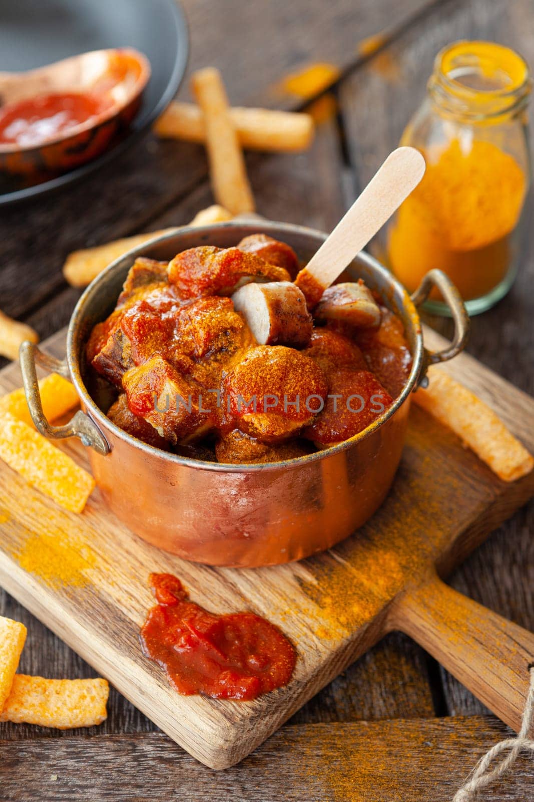 Delicious bratwurst with a spicy tomato curry sauce