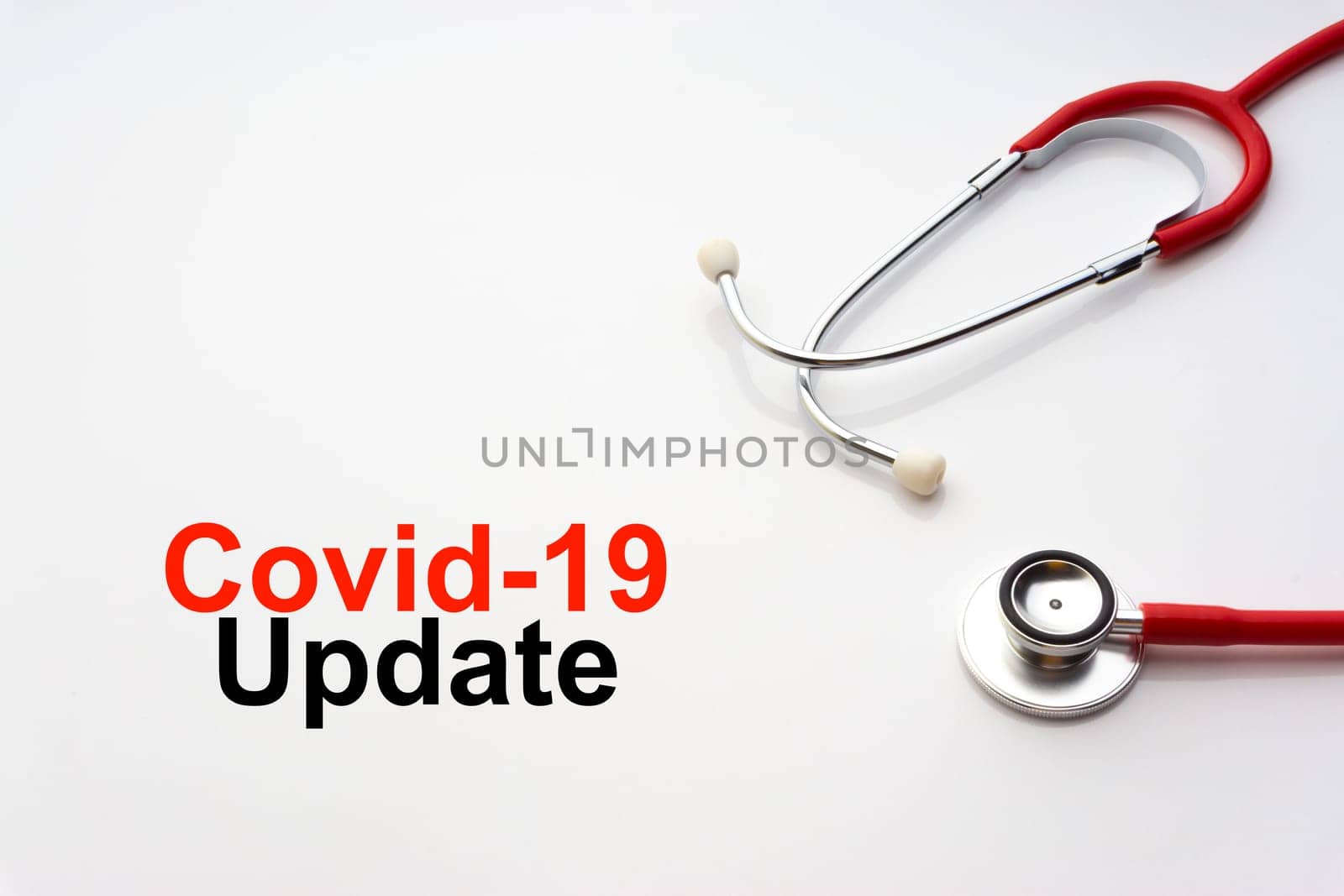 COVID-19 UPDATE text with stethoscope on white background. Covid or Coronavirus Concept